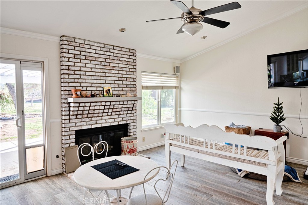 33342 Trail Ranch Road Agua Dulce, CA 91390 - Photo 19 of 40 a living room with furniture and a fireplace