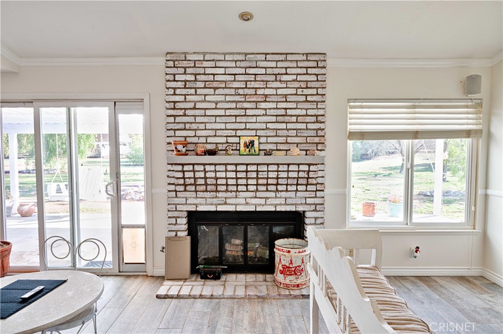 33342 Trail Ranch Road Agua Dulce, CA 91390 - Photo 20 of 40 a living room with furniture and a fireplace