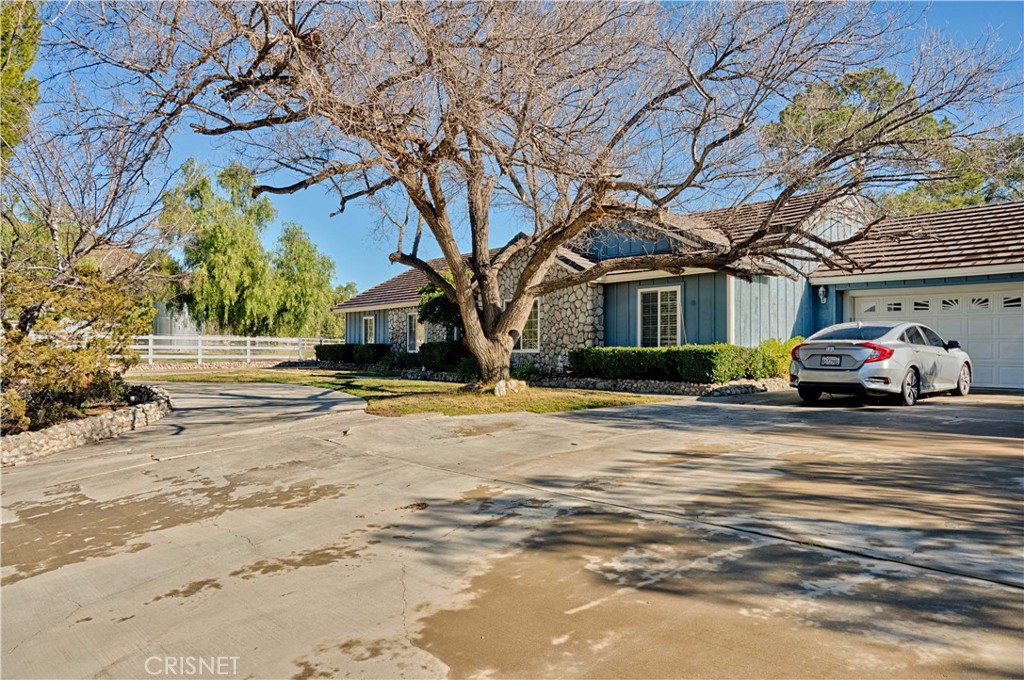33342 Trail Ranch Road Agua Dulce, CA 91390 - Photo 2 of 40 a car parked in front of house