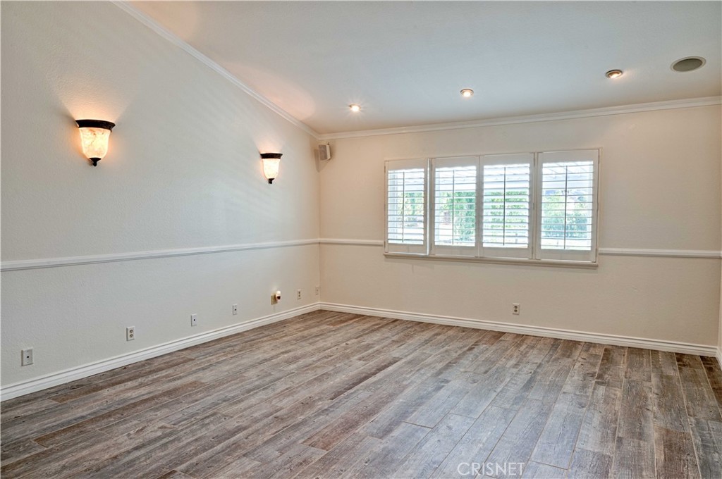 33342 Trail Ranch Road Agua Dulce, CA 91390 - Photo 30 of 40 an empty room with wooden floor and windows