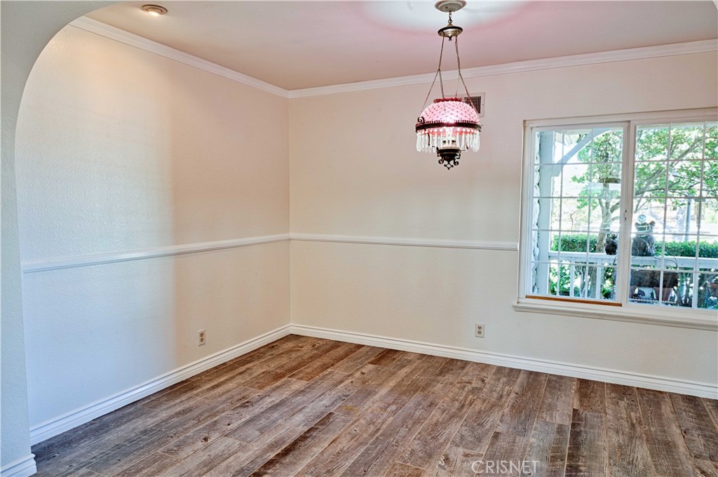 33342 Trail Ranch Road Agua Dulce, CA 91390 - Photo 33 of 40 a room with a window and wooden floor