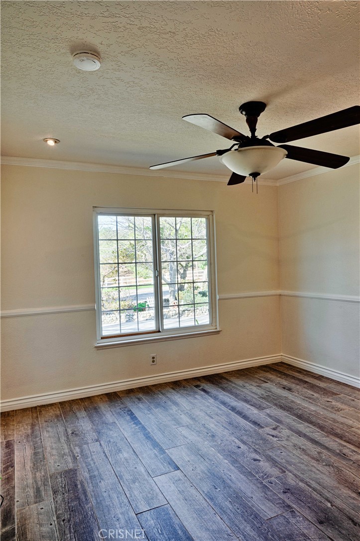 33342 Trail Ranch Road Agua Dulce, CA 91390 - Photo 38 of 40 wooden floor in an empty room with a window