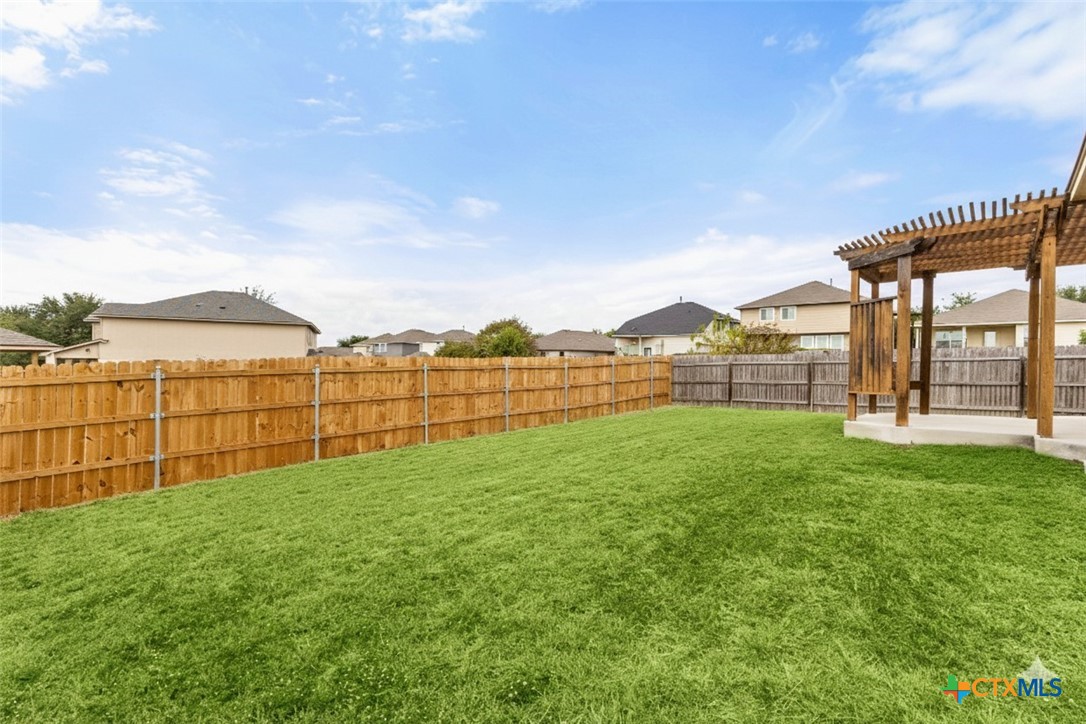 2909 Oak Branch Ridge New Braunfels, TX 78130 - Photo 32 of 39 backyard, grass is virtually enhanced with color
