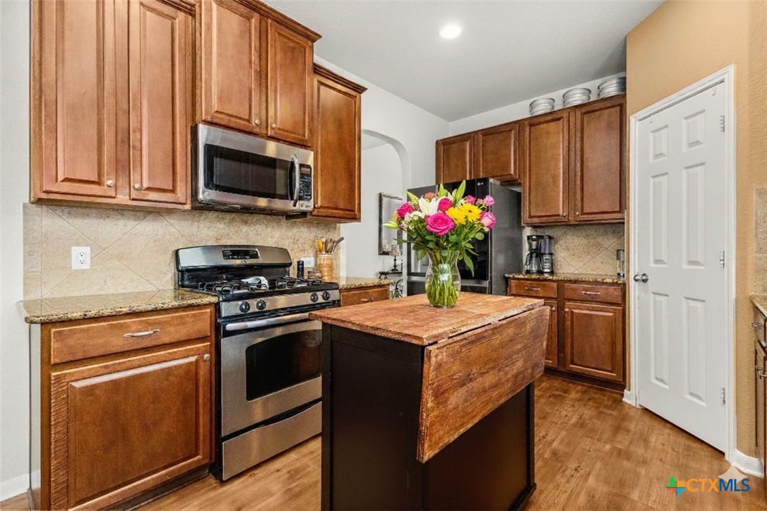 2909 Oak Branch Ridge New Braunfels, TX 78130 - Photo 10 of 39 Kitchen, some items virtually staged, home is vacant, island is removable and on wheels