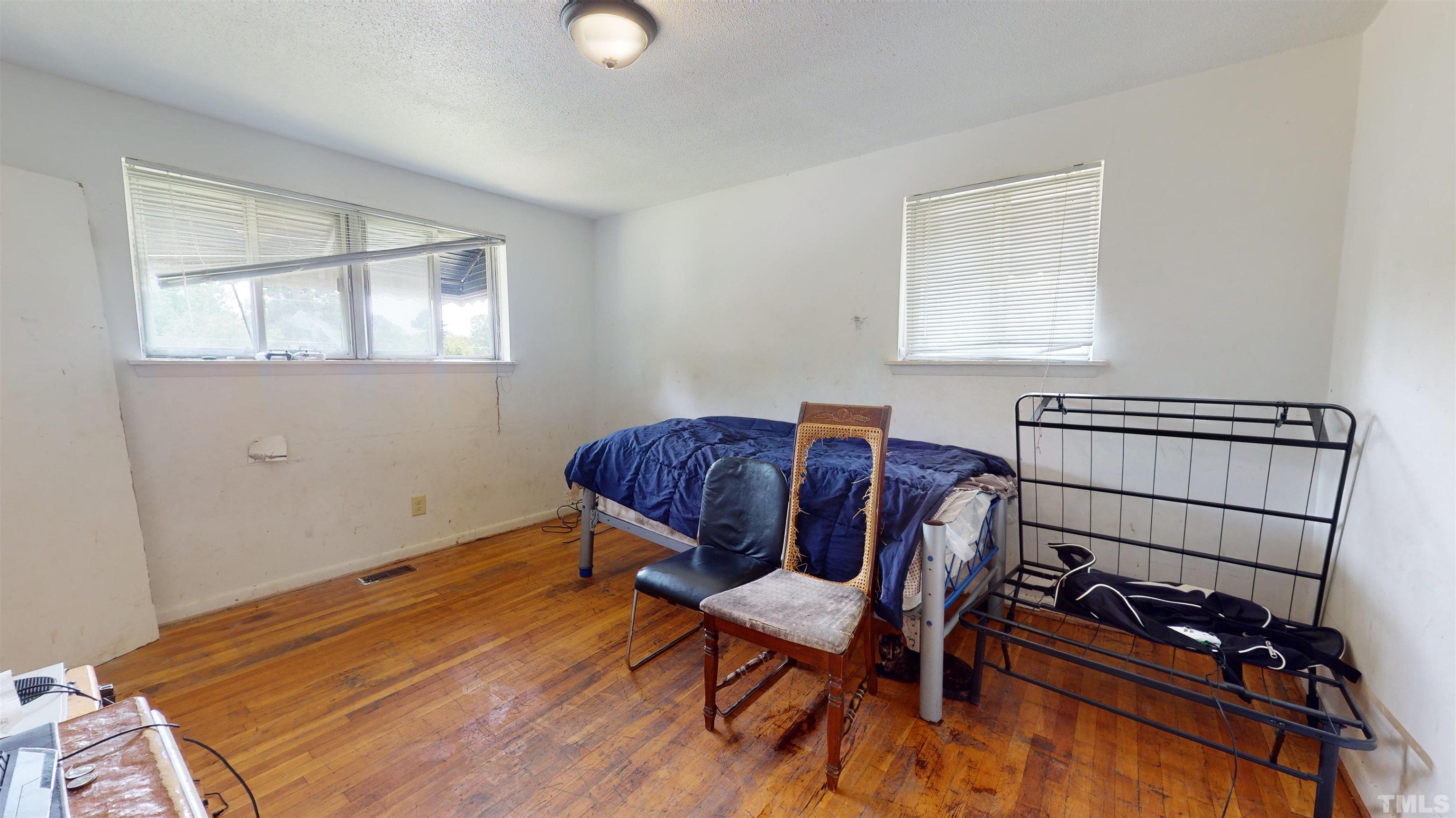 1101 Kitt Place Raleigh, NC 27610 - Photo 15 of 41 a bedroom with a bed and a window