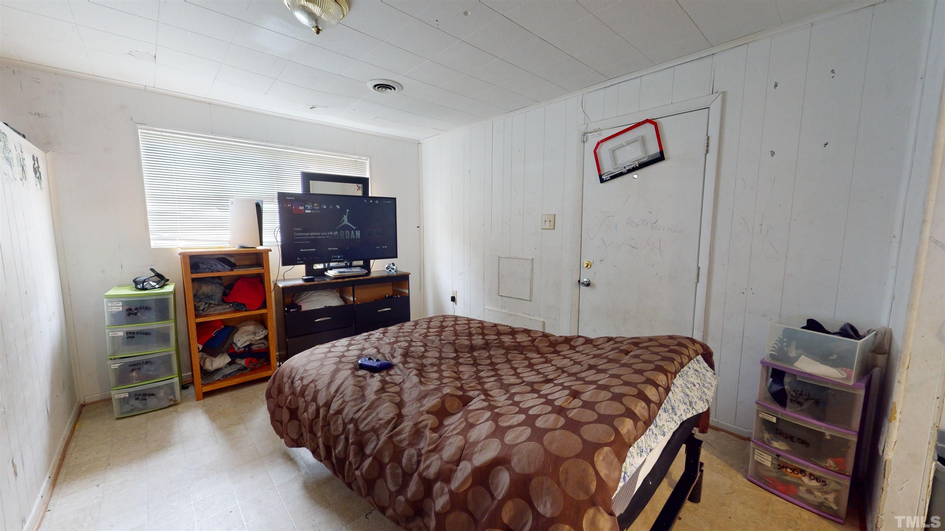 1101 Kitt Place Raleigh, NC 27610 - Photo 21 of 41 a bedroom with a bed and a television