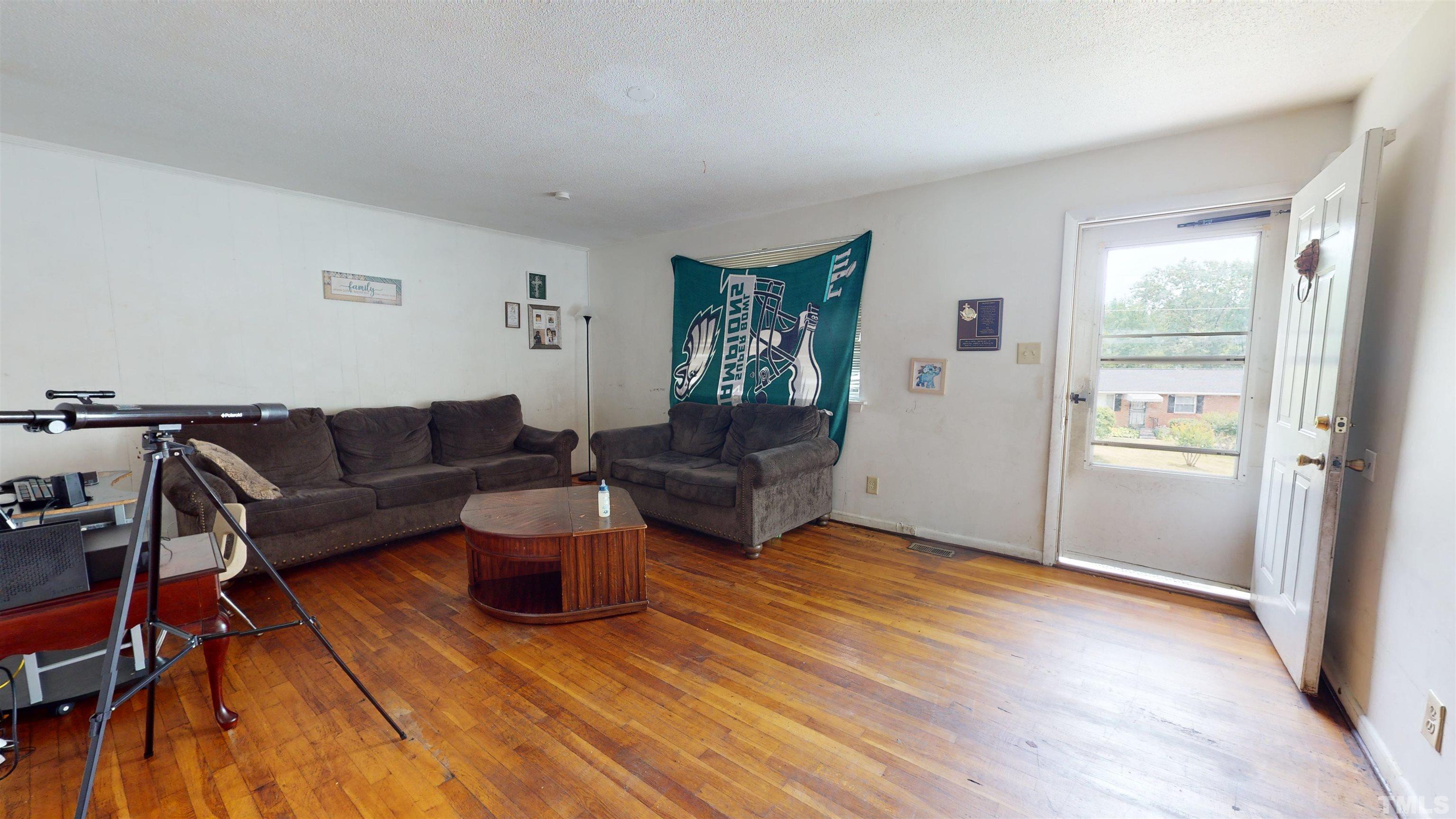 1101 Kitt Place Raleigh, NC 27610 - Photo 4 of 41 a living room with furniture and a wooden floor