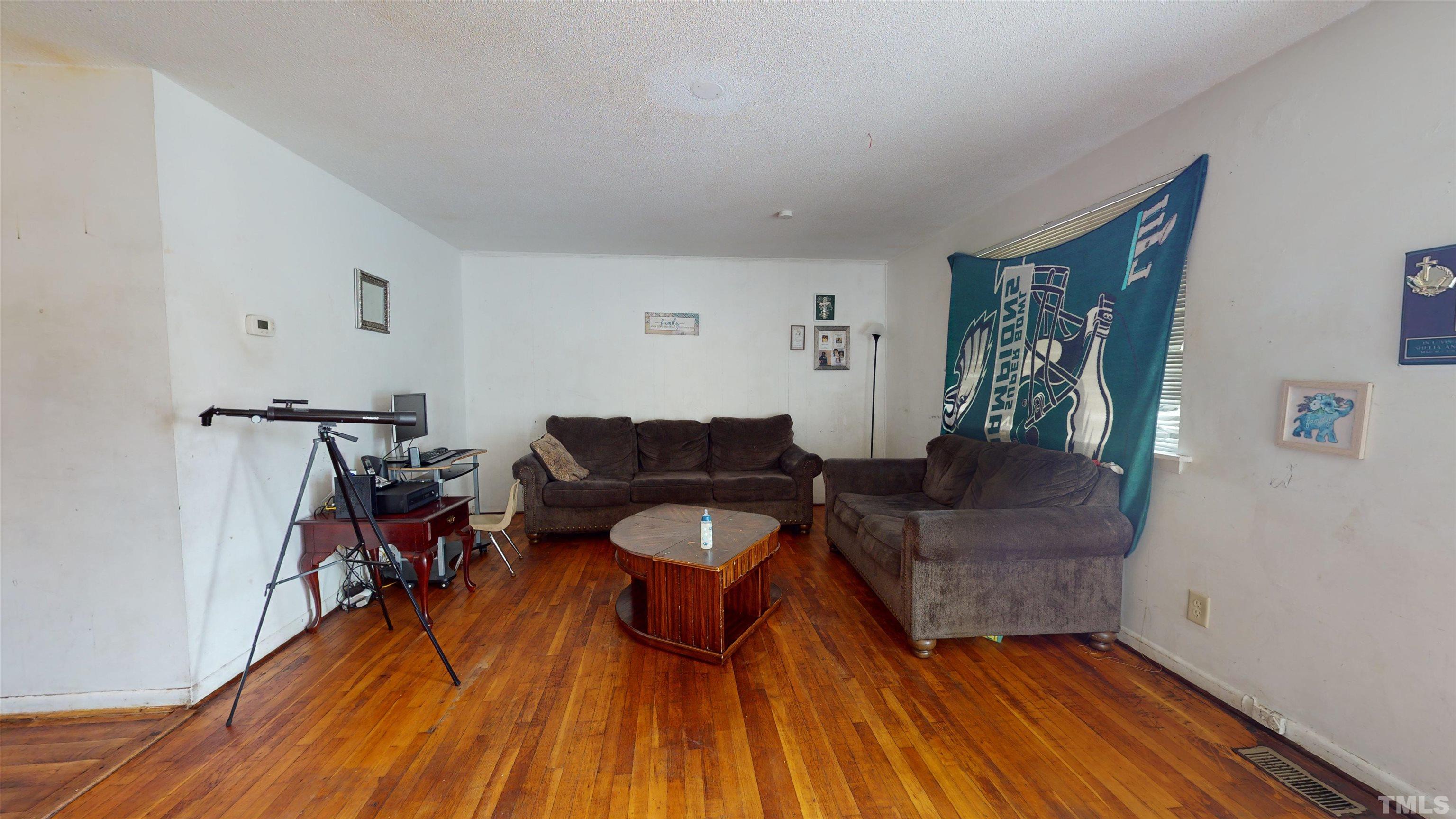 1101 Kitt Place Raleigh, NC 27610 - Photo 5 of 41 a living room with furniture and a wooden floor