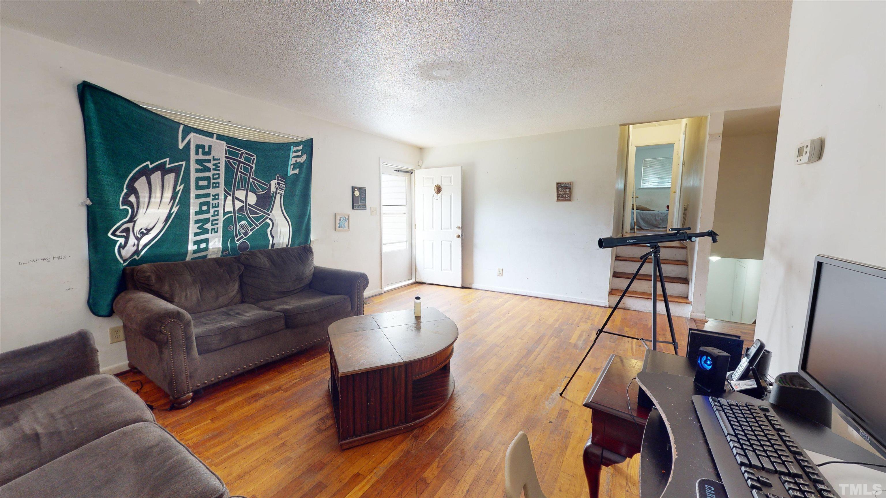 1101 Kitt Place Raleigh, NC 27610 - Photo 6 of 41 a living room with furniture and wooden floor