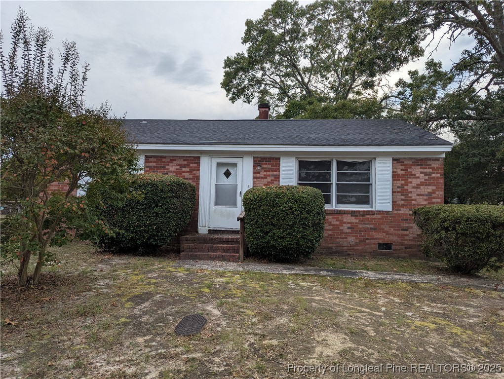 307 Elaine Street Spring Lake, NC 28390 - Photo 1 of 7 a view of a house with a yard and plants