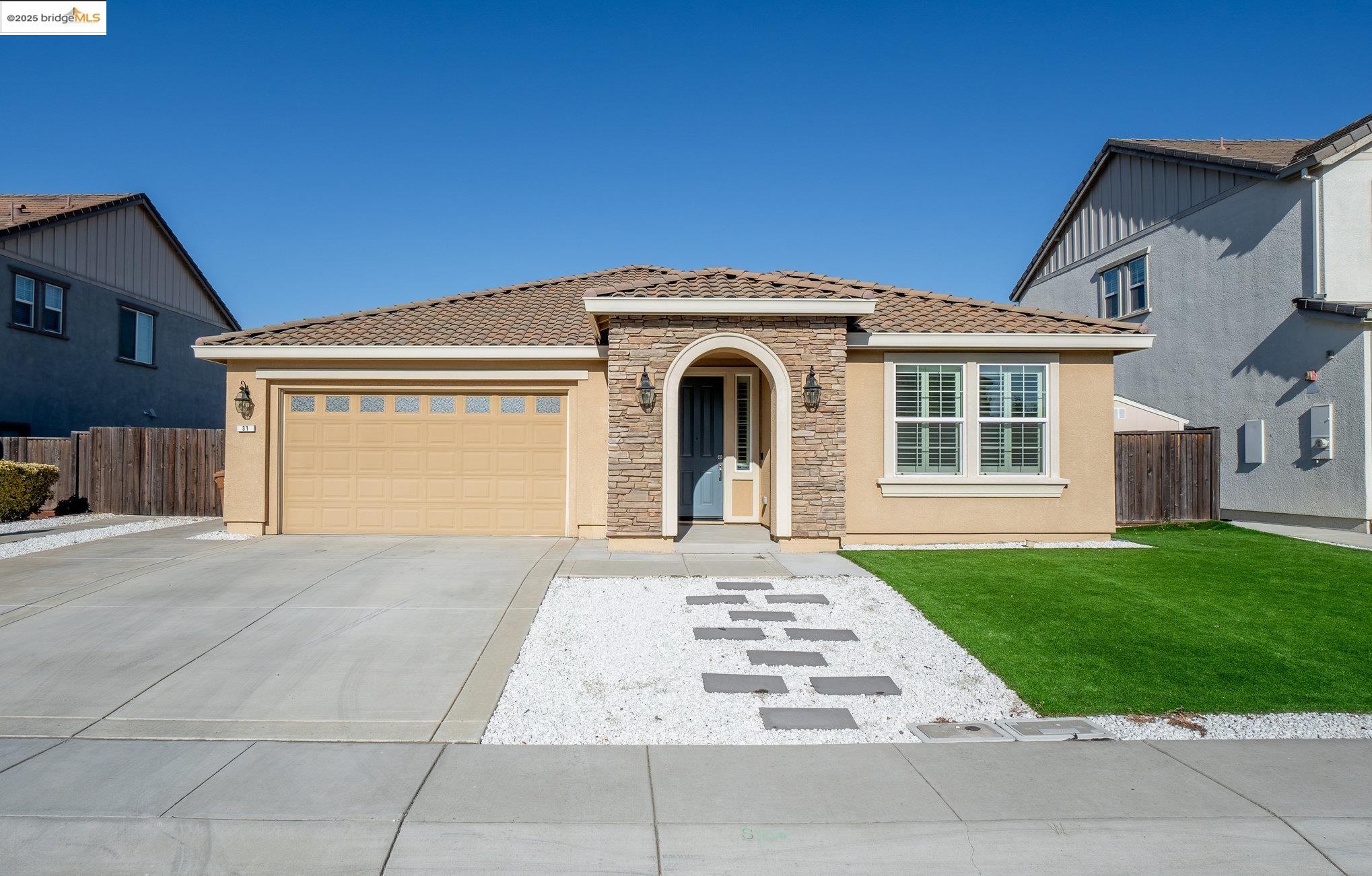 31 Rustic Court Oakley, CA 94561 - Photo 1 of 52 a front view of a house with a yard
