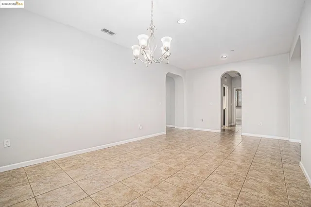 a kitchen with a stove a sink and a refrigerator