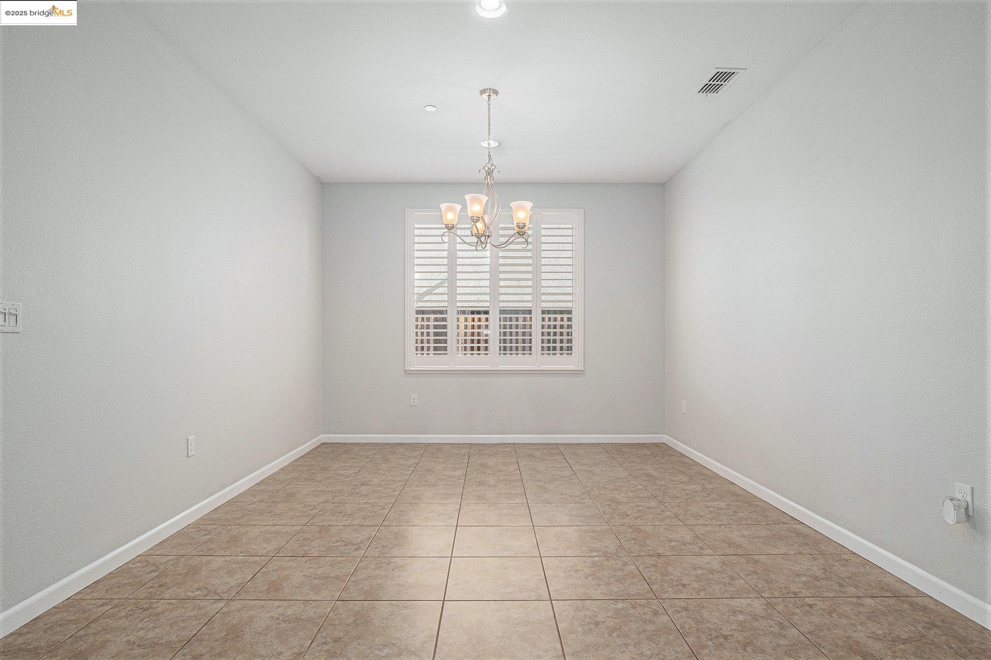 31 Rustic Court Oakley, CA 94561 - Photo 15 of 52 an empty room with windows and chandelier fan