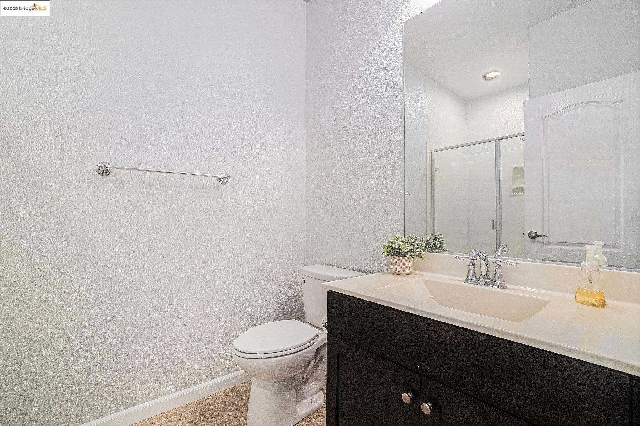 31 Rustic Court Oakley, CA 94561 - Photo 16 of 52 a bathroom with a sink a toilet and mirror