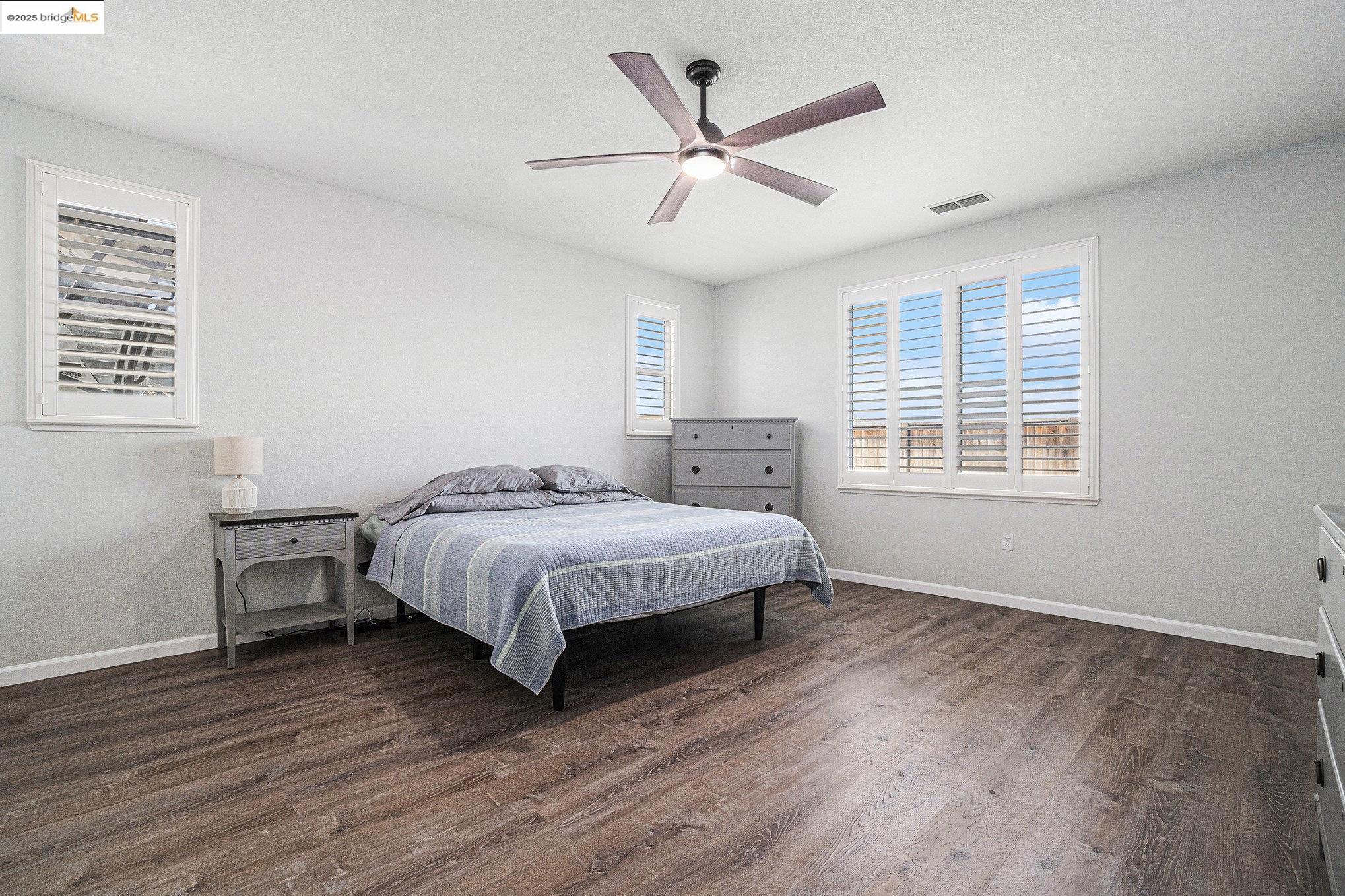 31 Rustic Court Oakley, CA 94561 - Photo 19 of 52 a spacious bedroom with a bed and a window