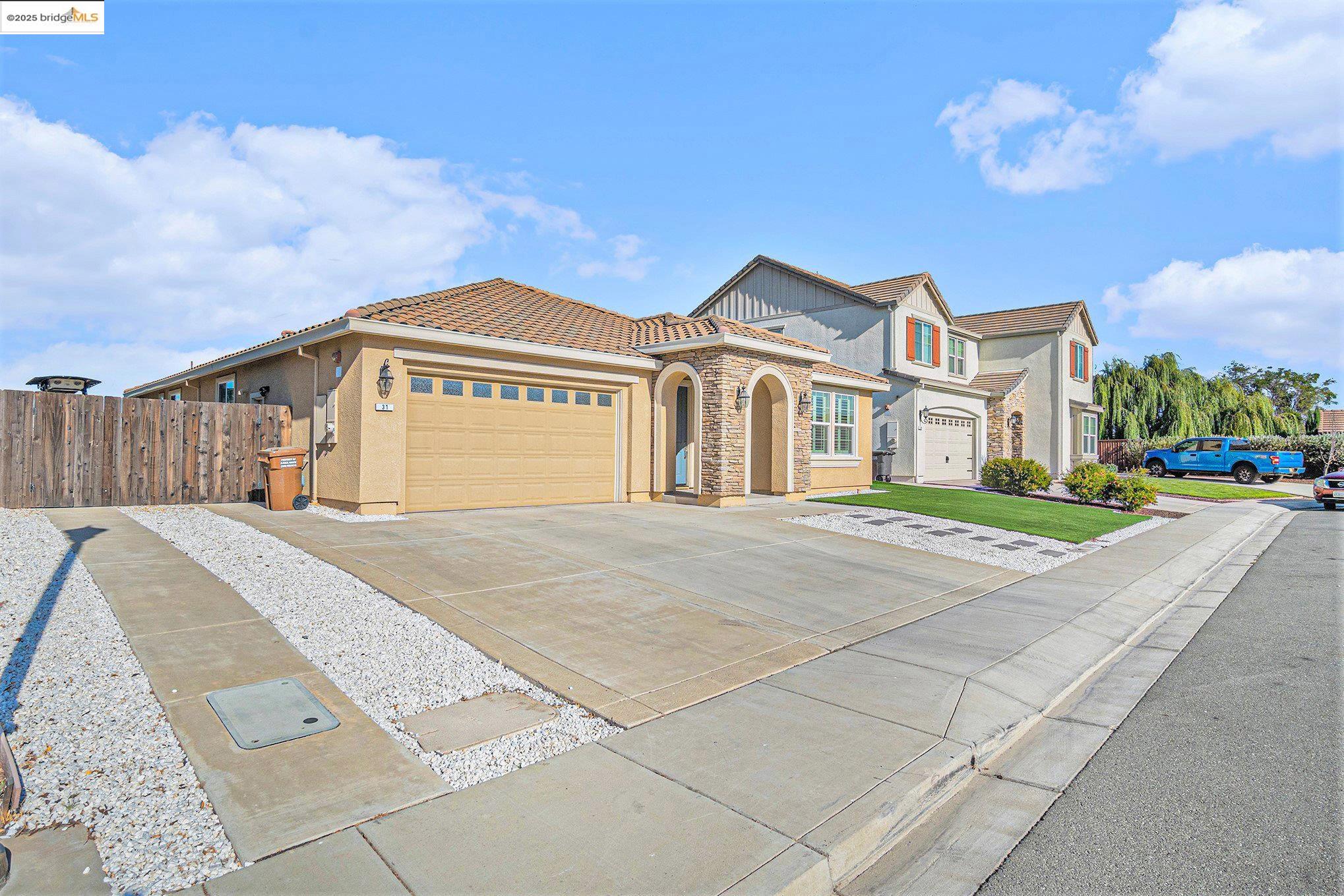 31 Rustic Court Oakley, CA 94561 - Photo 2 of 52 a front view of a house with a yard