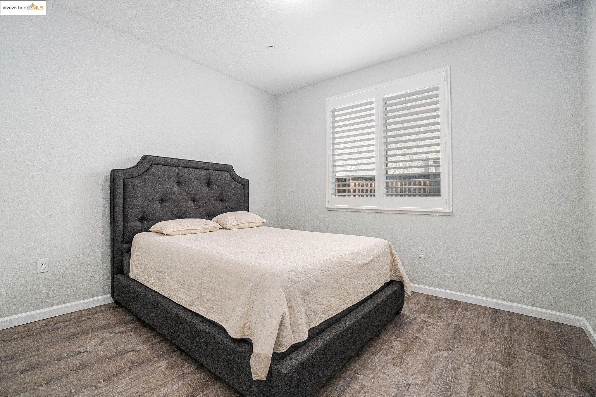 31 Rustic Court Oakley, CA 94561 - Photo 25 of 52 a large bed sitting in a bedroom next to a window