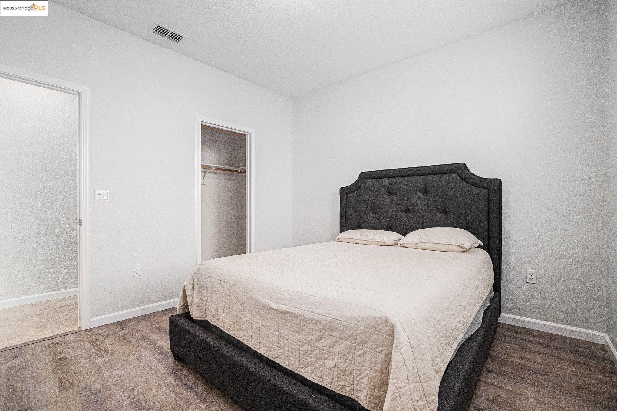31 Rustic Court Oakley, CA 94561 - Photo 26 of 52 a bedroom with a bed and wooden floor