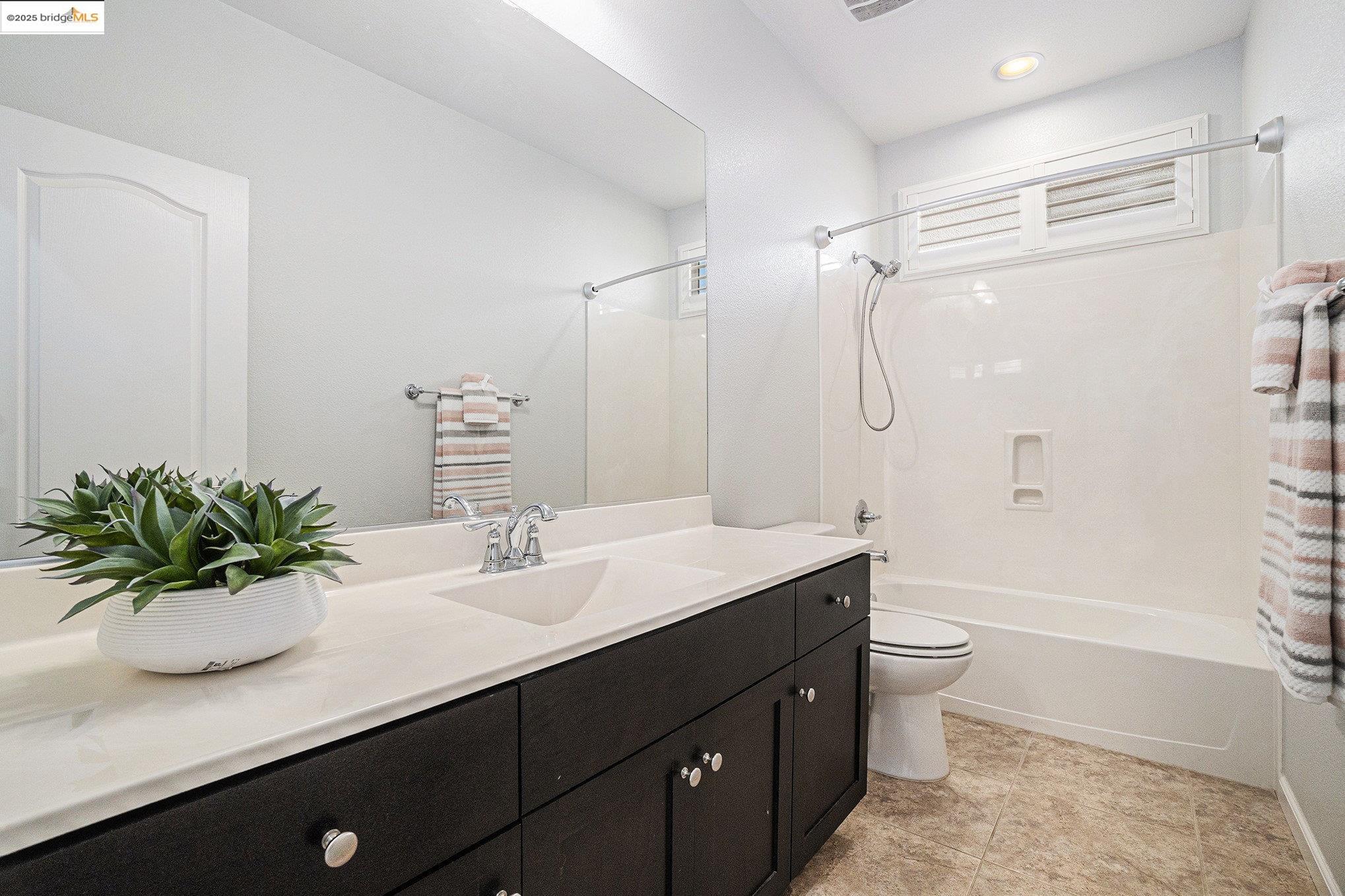 31 Rustic Court Oakley, CA 94561 - Photo 30 of 52 a bathroom with a sink a toilet a tub and shower