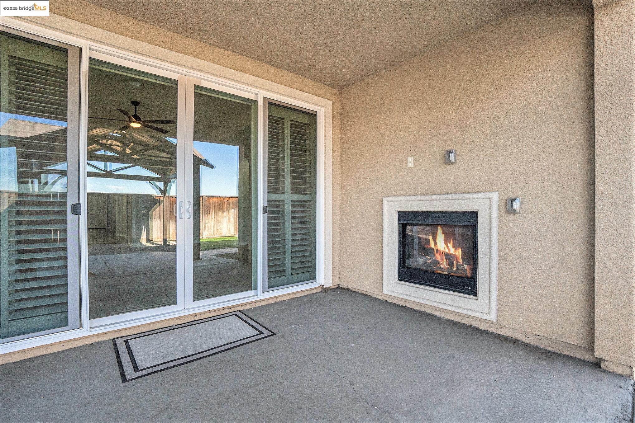 31 Rustic Court Oakley, CA 94561 - Photo 32 of 52 a view of an empty room with a fireplace and a window