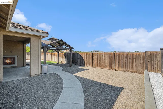 a view of a back yard of the house