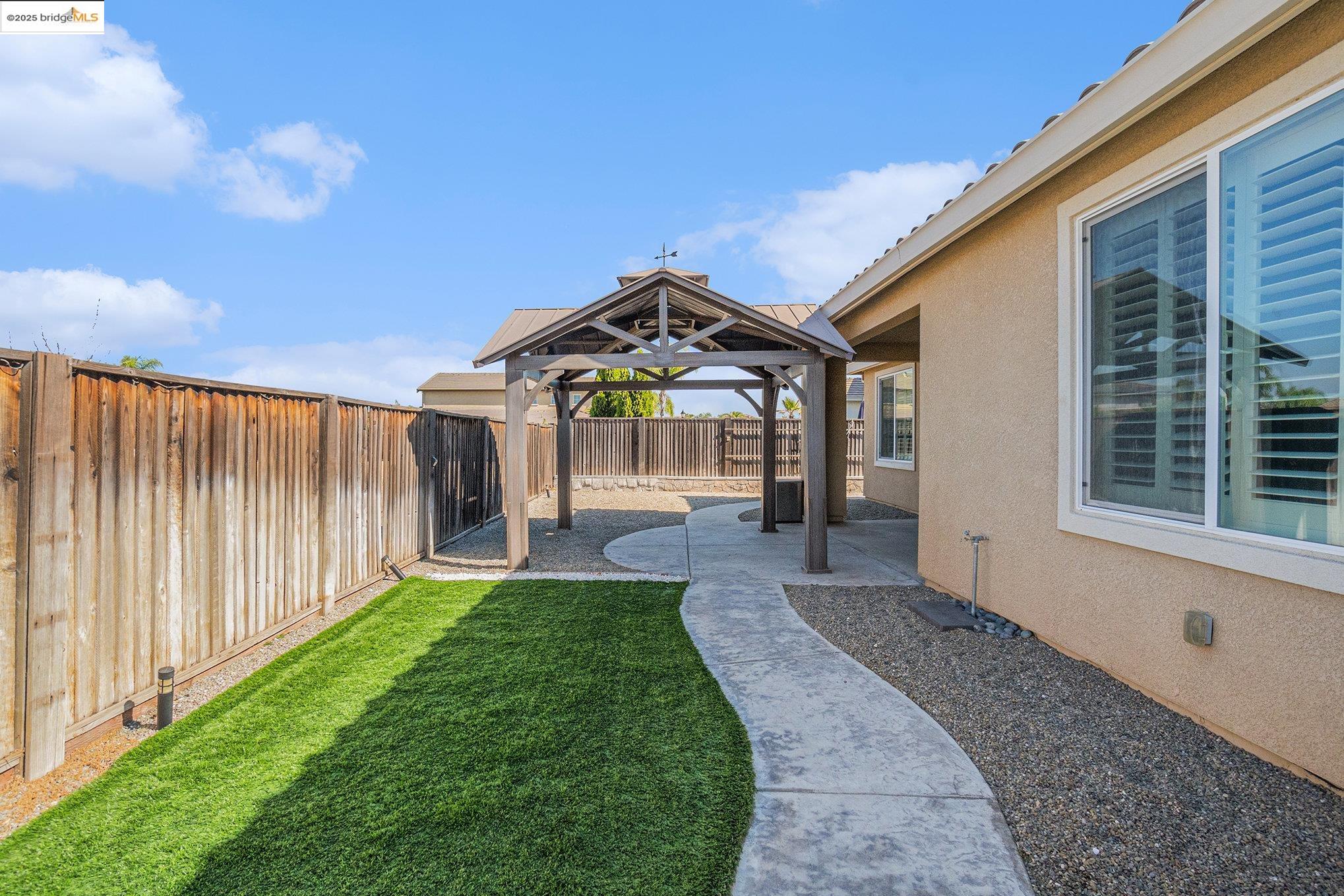 31 Rustic Court Oakley, CA 94561 - Photo 39 of 52 a view of a house with a small yard and wooden fence