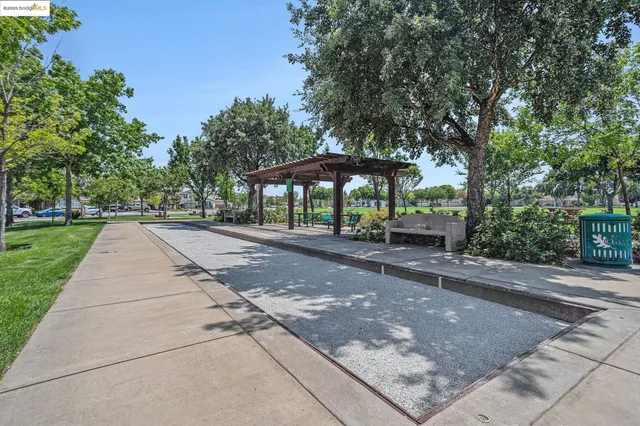 a park view with a fountain back yard