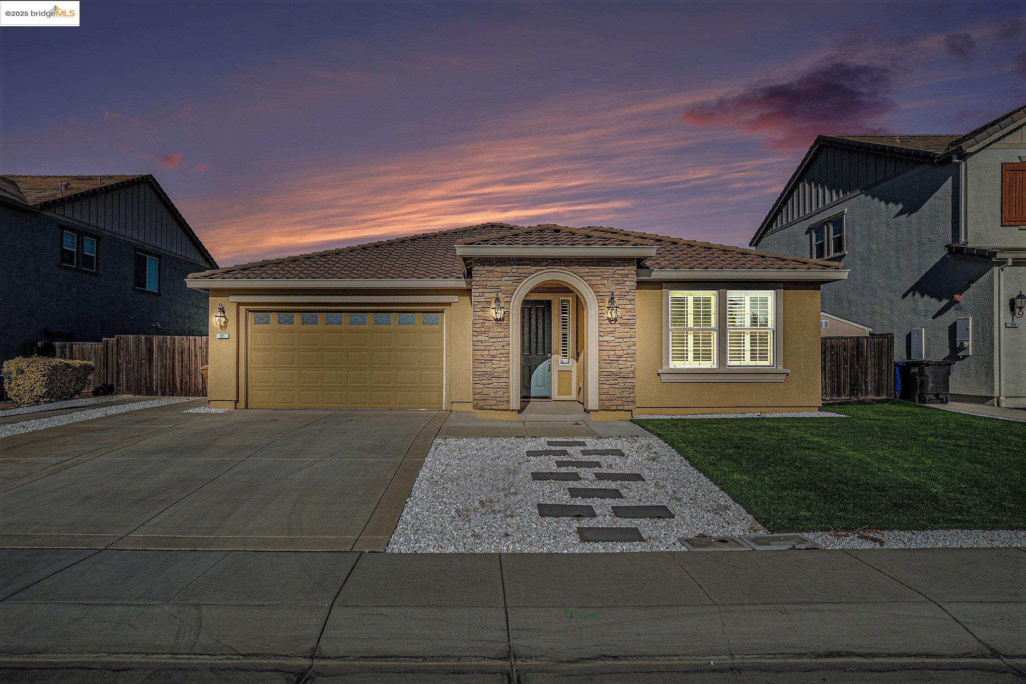 31 Rustic Court Oakley, CA 94561 - Photo 49 of 52 a front view of a house with a yard and garage