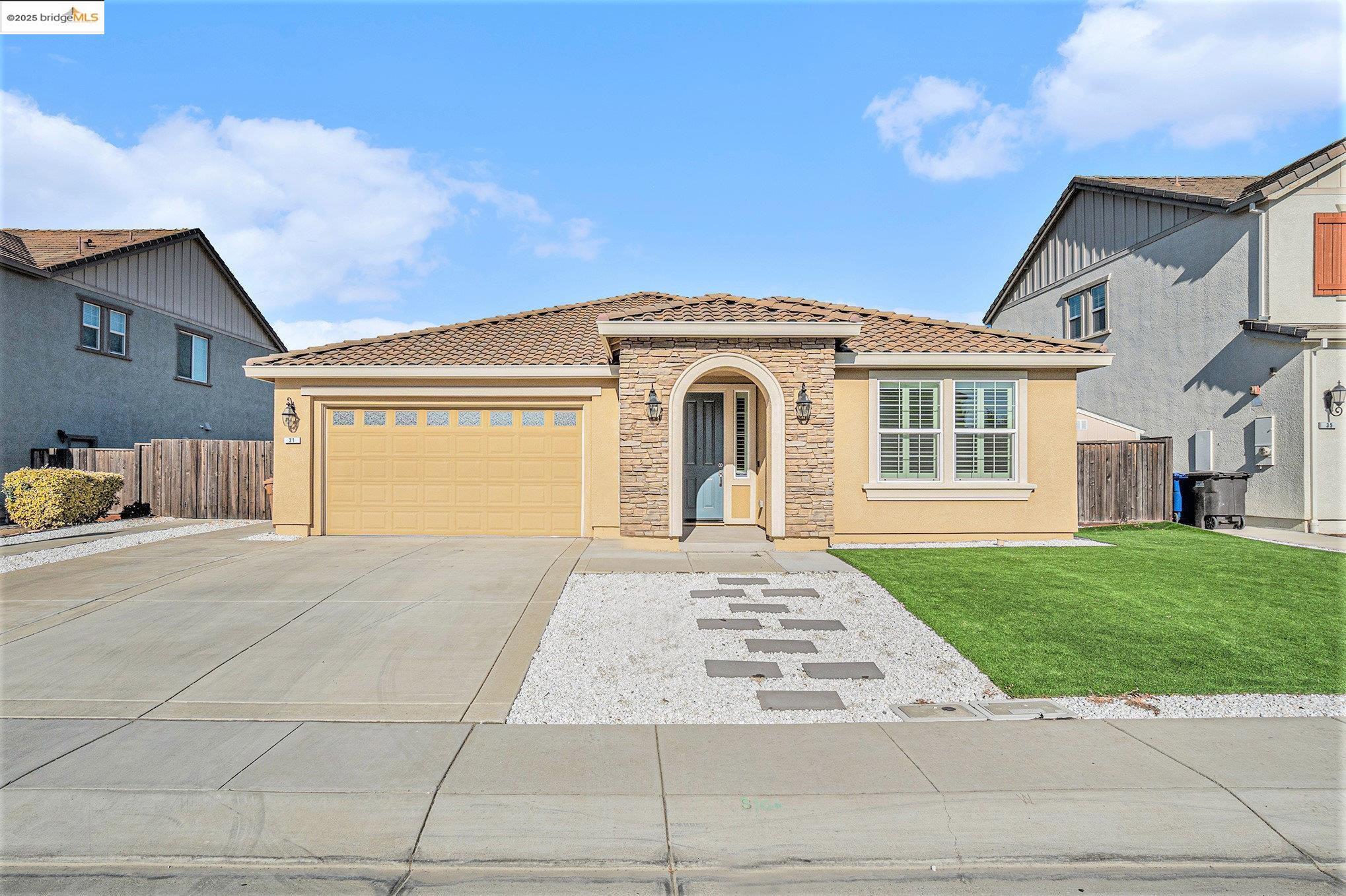 31 Rustic Court Oakley, CA 94561 - Photo 50 of 52 a front view of a house with a yard and garage