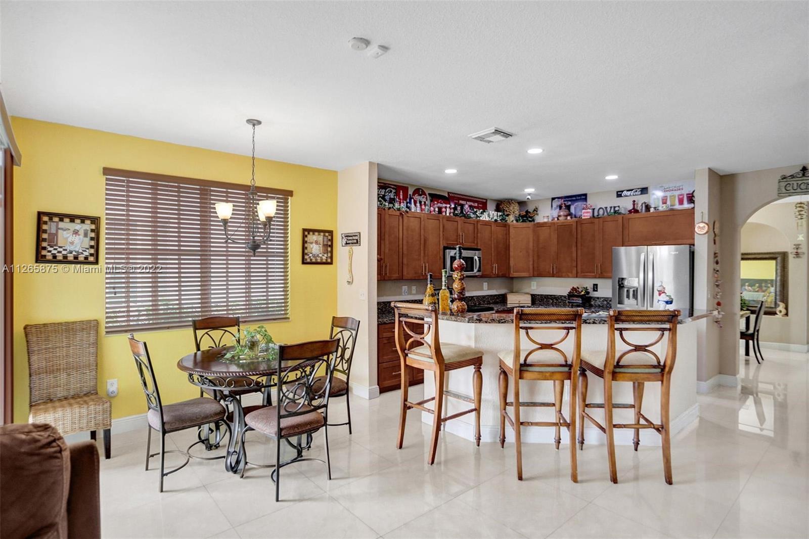 27846 Southwest 142nd Avenue Homestead, FL 33032 - Photo 12 of 56 a view of a dining room with furniture