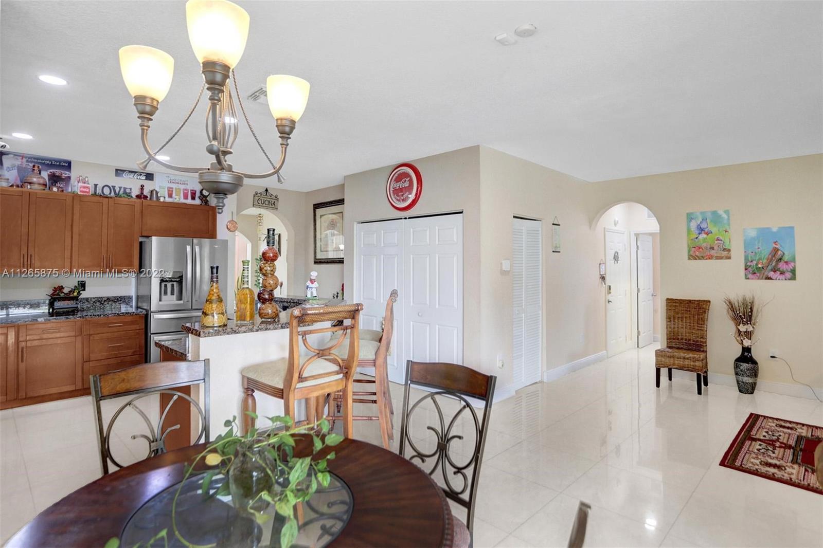 27846 Southwest 142nd Avenue Homestead, FL 33032 - Photo 13 of 56 a view of a dining room with furniture