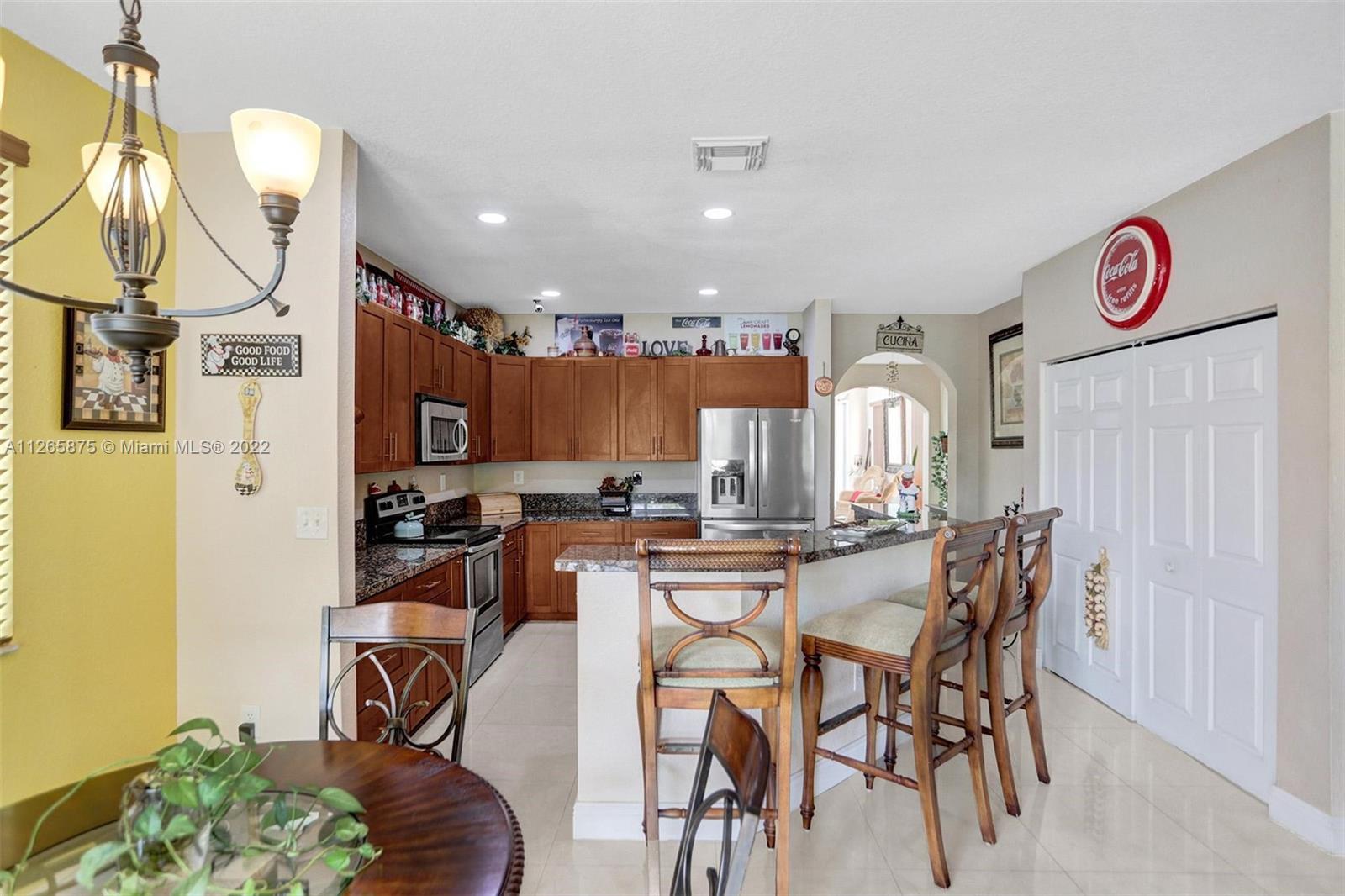 27846 Southwest 142nd Avenue Homestead, FL 33032 - Photo 14 of 56 a view of a dining room with furniture