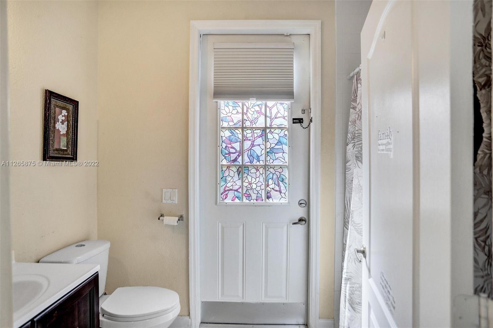 27846 Southwest 142nd Avenue Homestead, FL 33032 - Photo 19 of 56 a white toilet sitting next to a bathroom sink