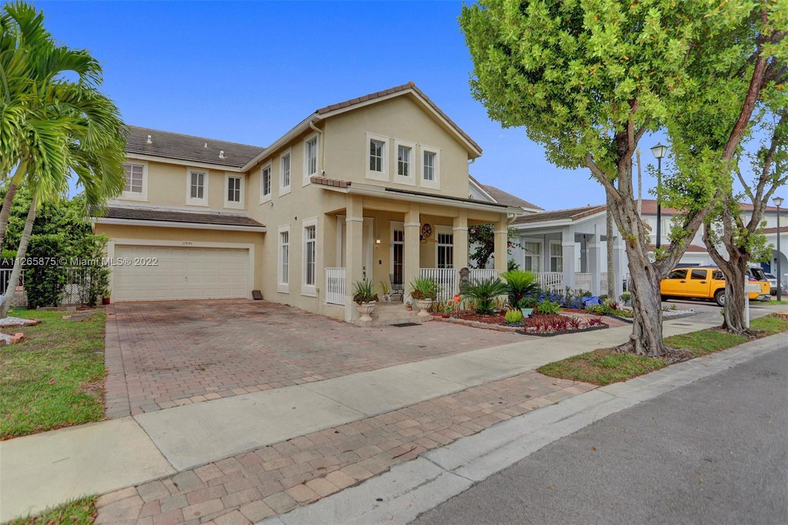 27846 Southwest 142nd Avenue Homestead, FL 33032 - Photo 2 of 56 front view of a house with a yard