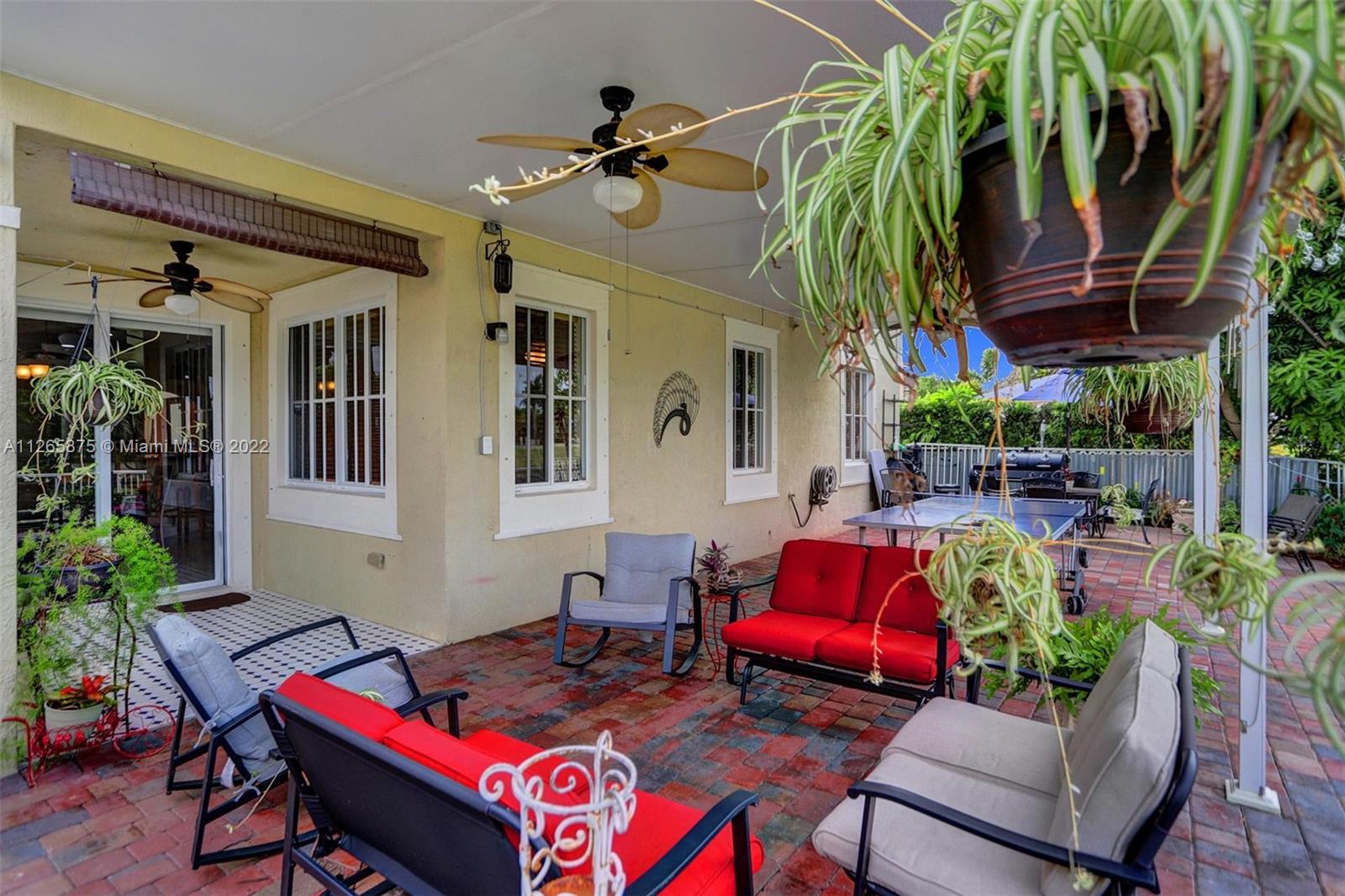 27846 Southwest 142nd Avenue Homestead, FL 33032 - Photo 23 of 56 a outdoor living space with furniture and a potted plant