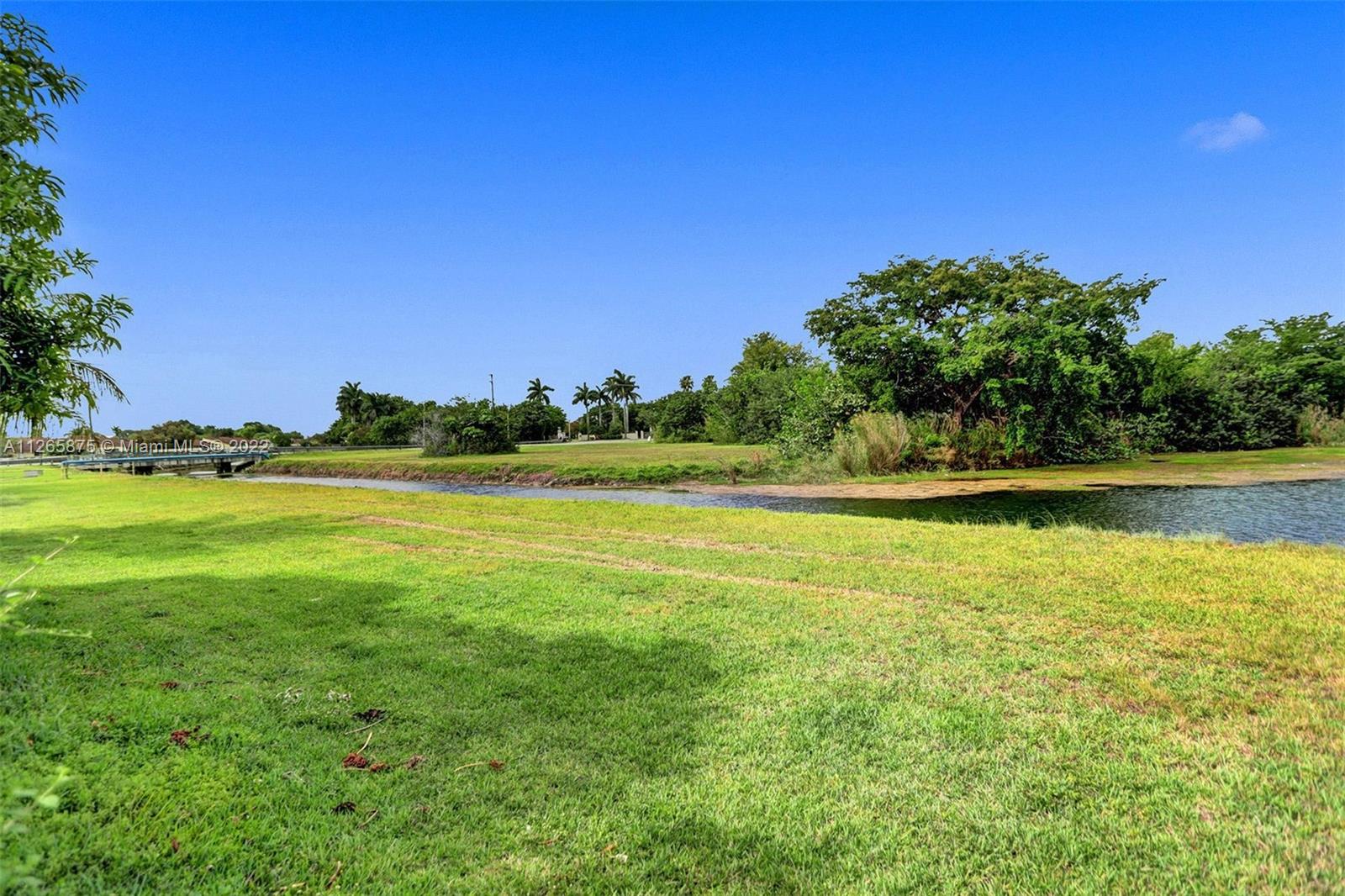 27846 Southwest 142nd Avenue Homestead, FL 33032 - Photo 28 of 56 a view of a swimming pool with an outdoor space and seating area