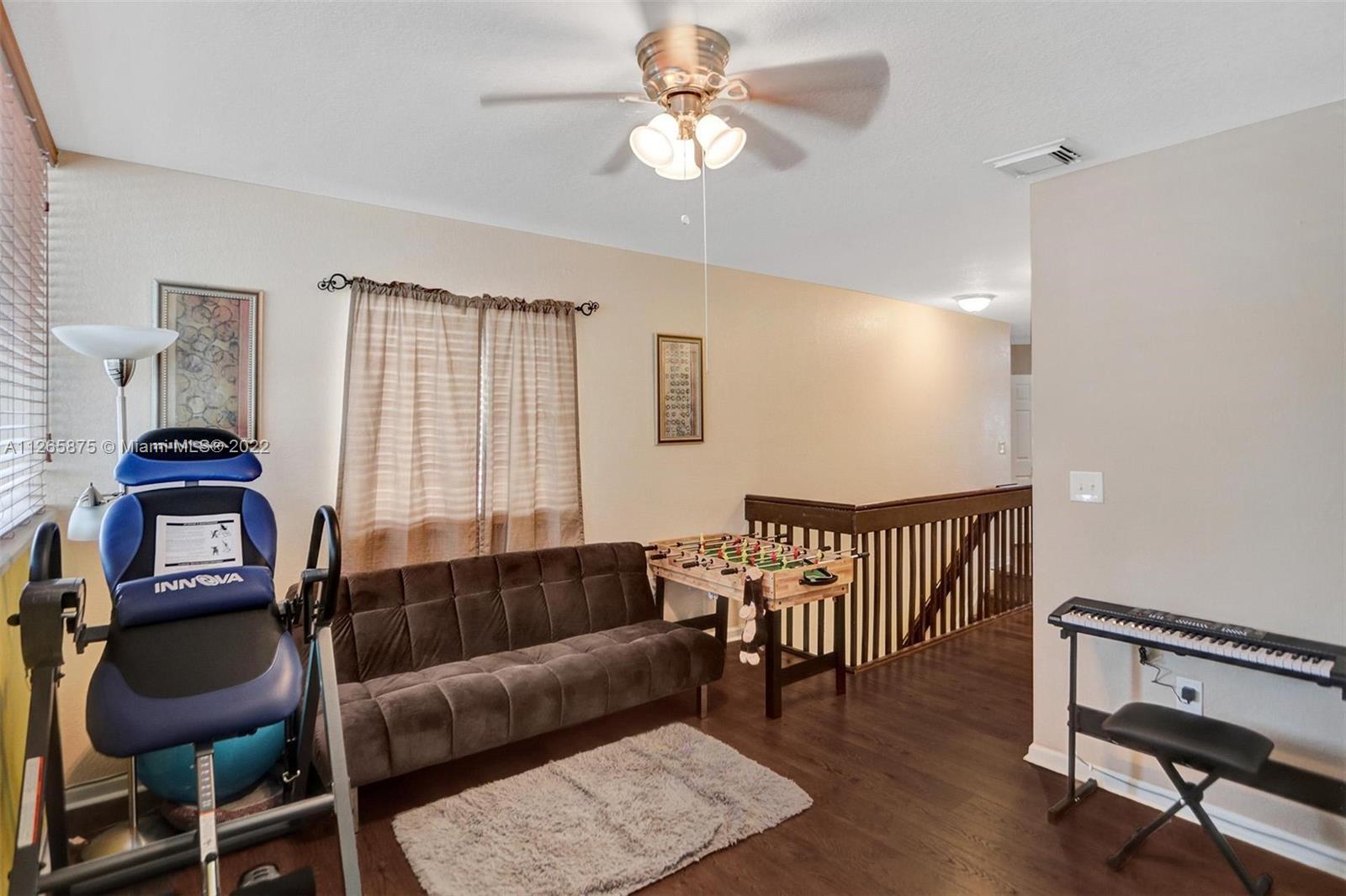 27846 Southwest 142nd Avenue Homestead, FL 33032 - Photo 31 of 56 a living room with furniture and a window