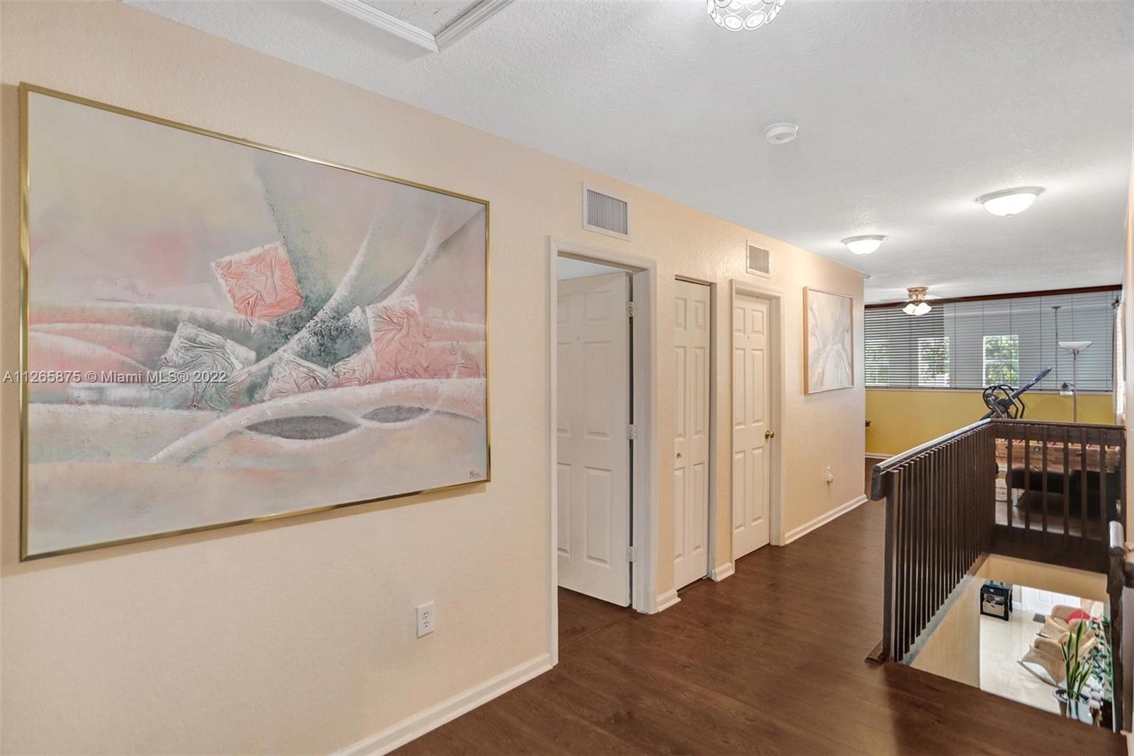 27846 Southwest 142nd Avenue Homestead, FL 33032 - Photo 33 of 56 a view of a hallway with wooden floor and entryway