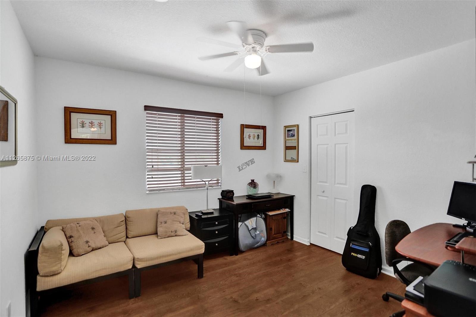 27846 Southwest 142nd Avenue Homestead, FL 33032 - Photo 34 of 56 a living room with furniture and a window