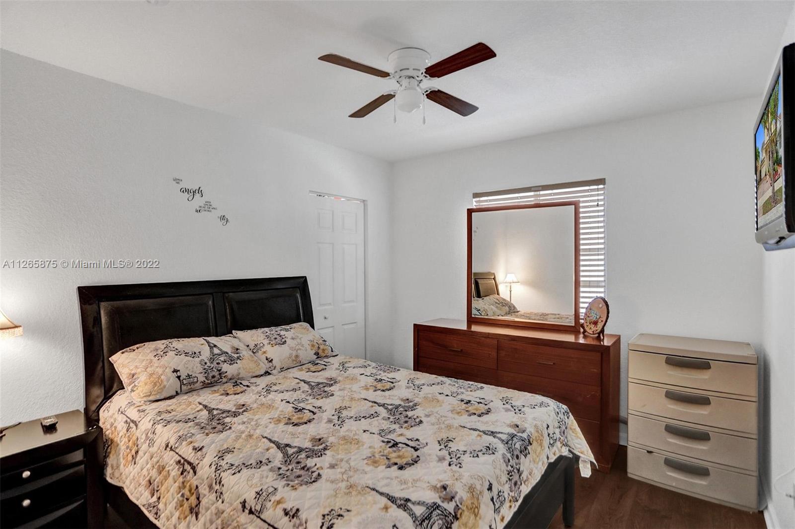 27846 Southwest 142nd Avenue Homestead, FL 33032 - Photo 36 of 56 a bedroom with a bed and a dresser