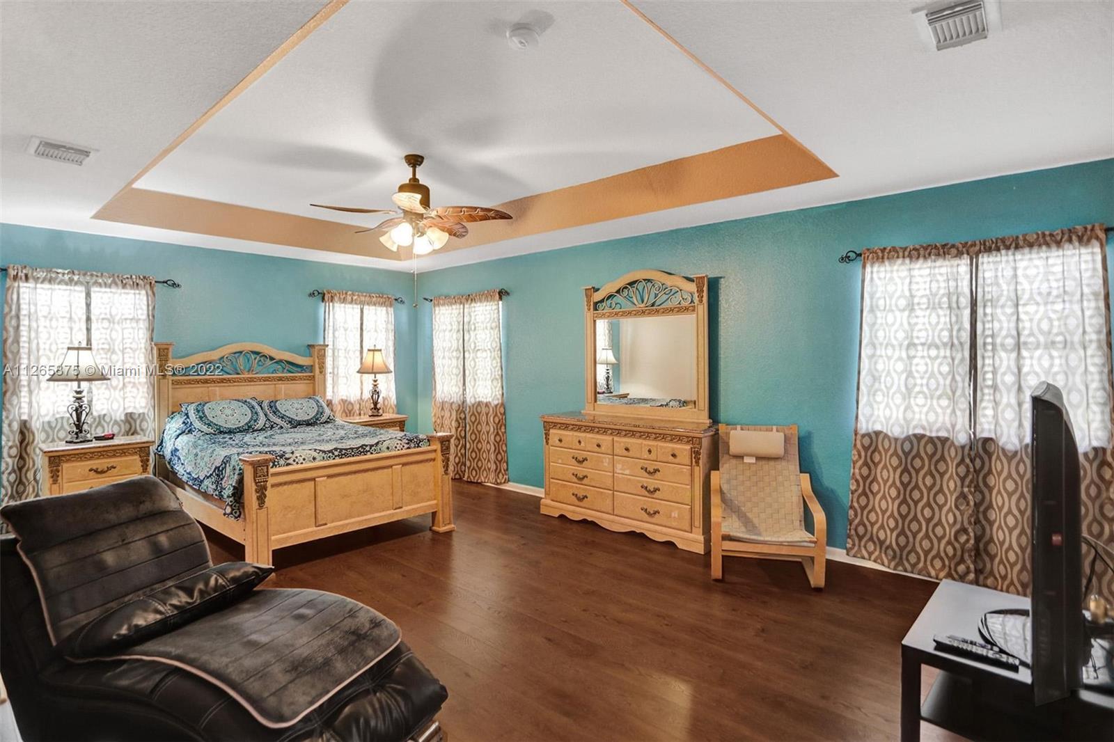 27846 Southwest 142nd Avenue Homestead, FL 33032 - Photo 37 of 56 a living room with furniture and wooden floor