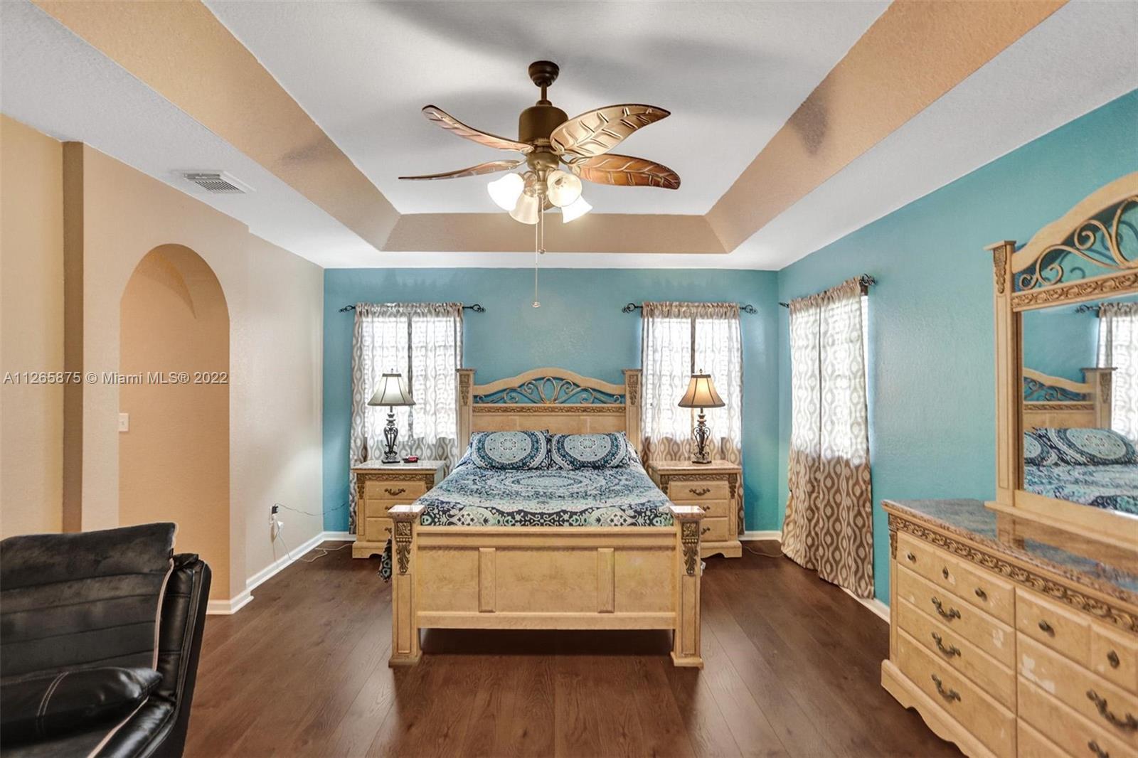 27846 Southwest 142nd Avenue Homestead, FL 33032 - Photo 38 of 56 a living room with furniture and wooden floor