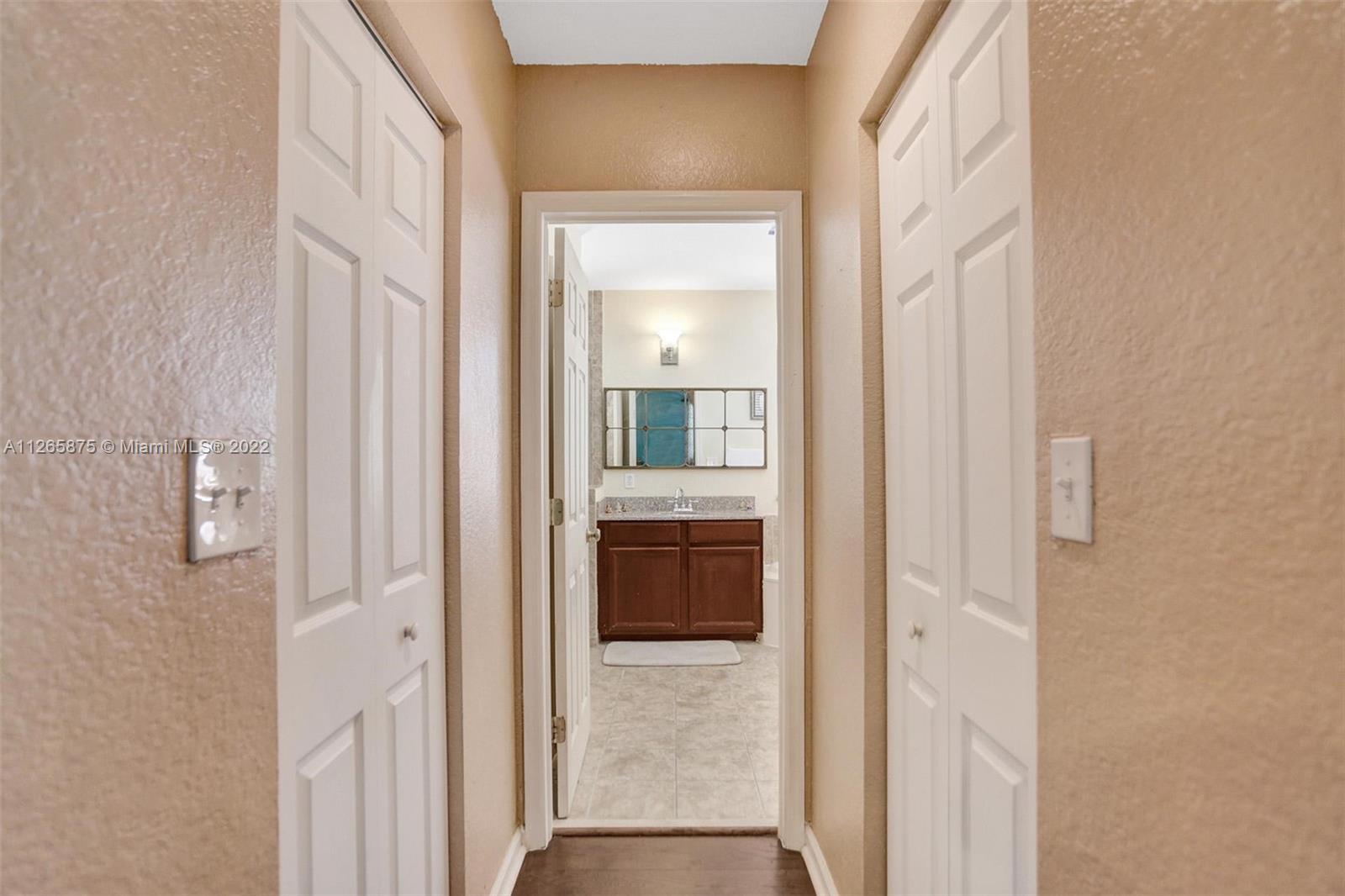 27846 Southwest 142nd Avenue Homestead, FL 33032 - Photo 40 of 56 a view of a bathroom from a hallway