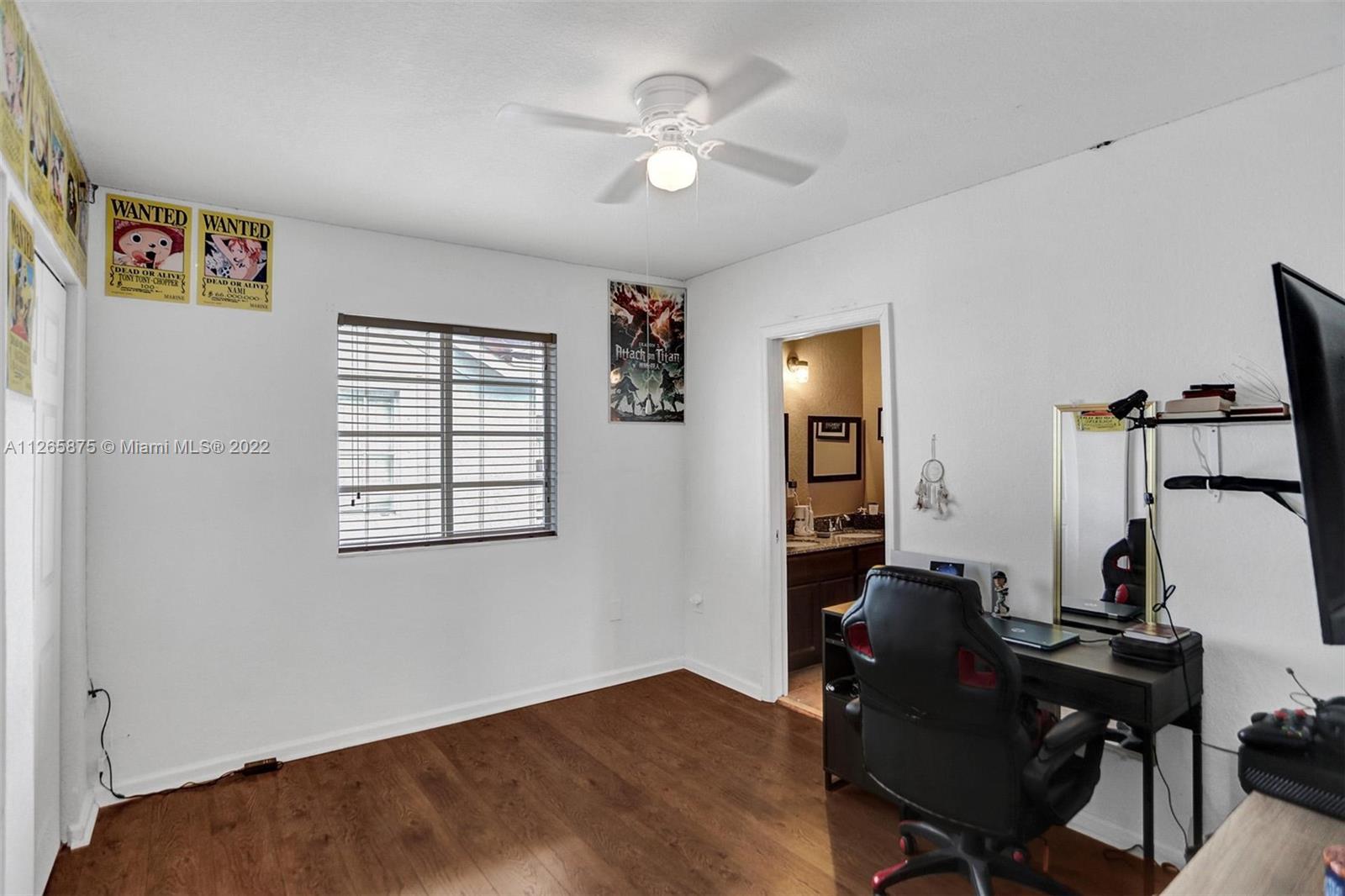 27846 Southwest 142nd Avenue Homestead, FL 33032 - Photo 43 of 56 a workspace with chandelier fan