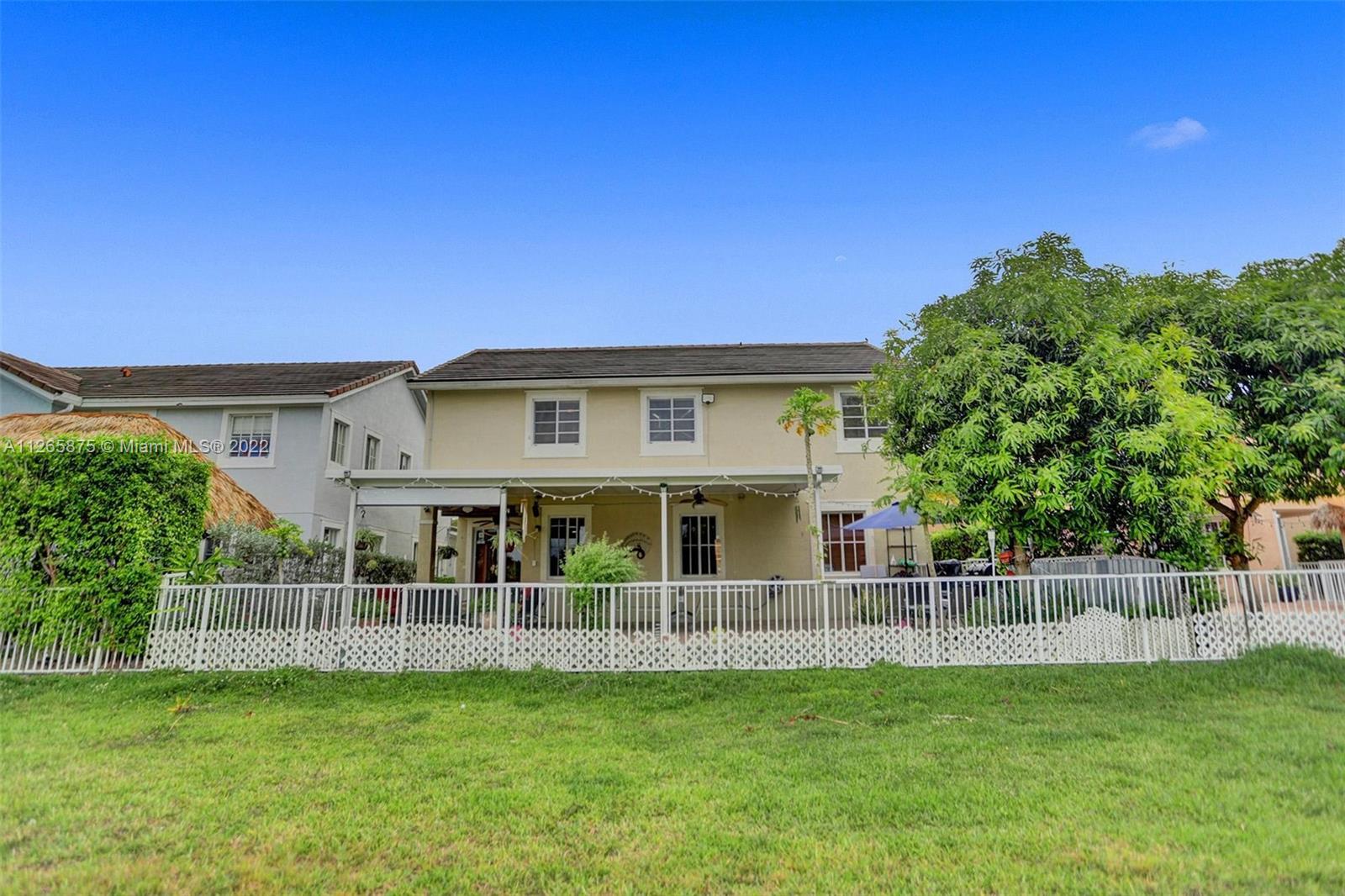 27846 Southwest 142nd Avenue Homestead, FL 33032 - Photo 46 of 56 a view of a house with a backyard
