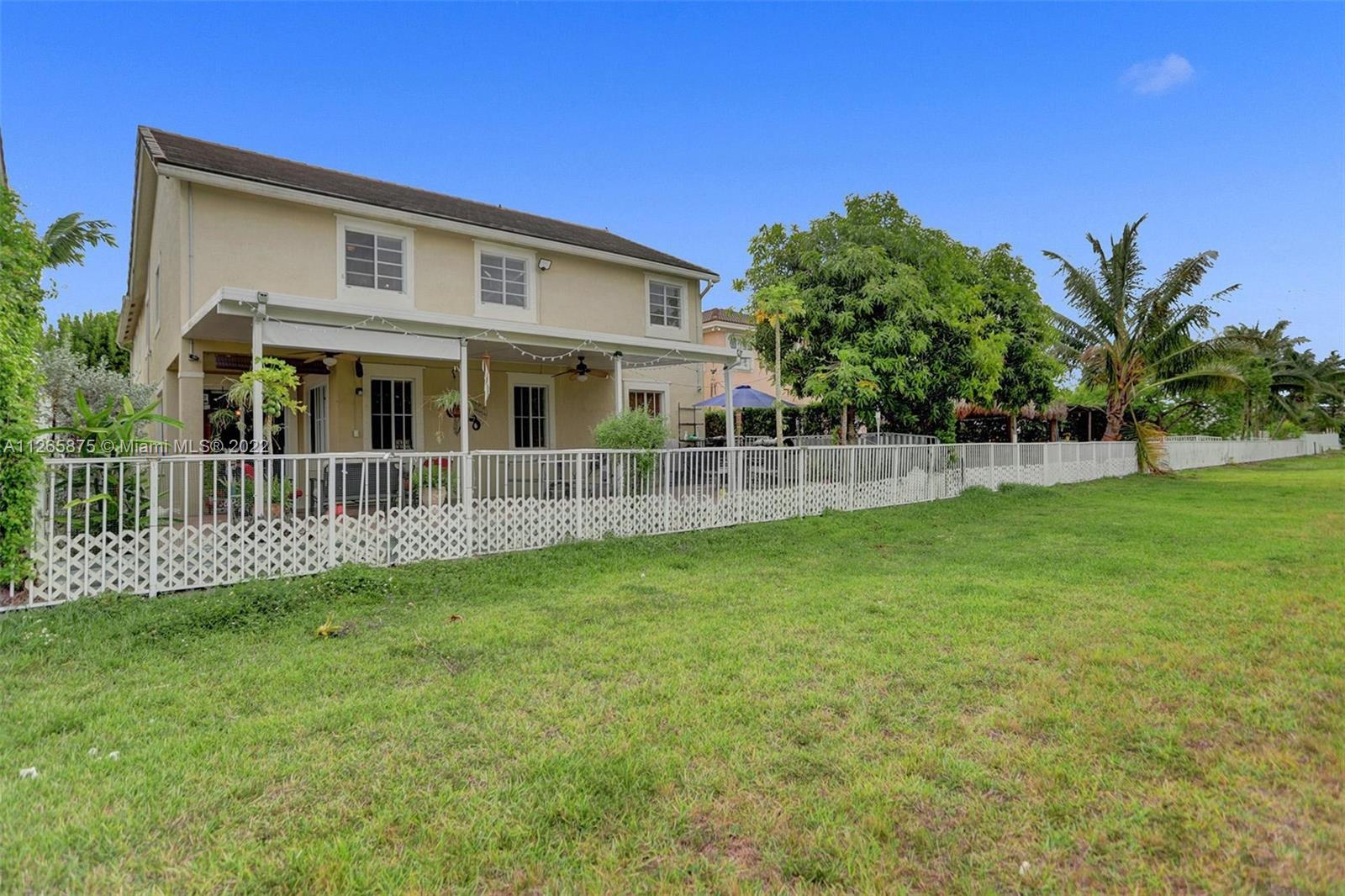 27846 Southwest 142nd Avenue Homestead, FL 33032 - Photo 47 of 56 a view of a house with a yard and a garden