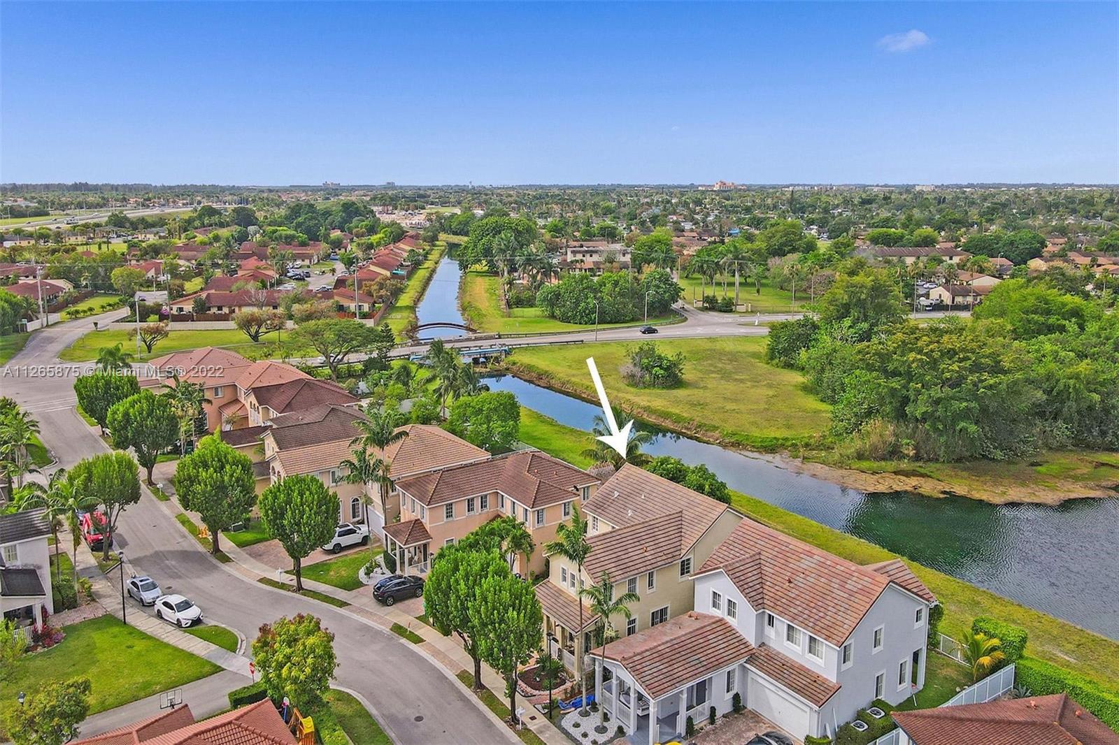 27846 Southwest 142nd Avenue Homestead, FL 33032 - Photo 48 of 56 an aerial view of residential houses with outdoor space and swimming pool