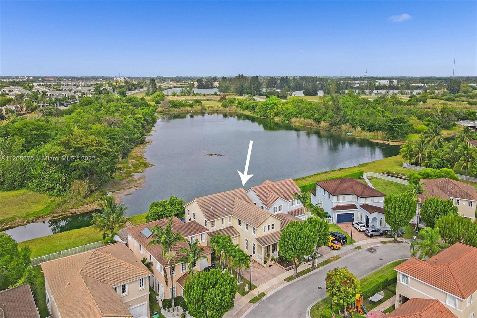 27846 Southwest 142nd Avenue Homestead, FL 33032 - Photo 53 of 56 an aerial view of a house with a lake view