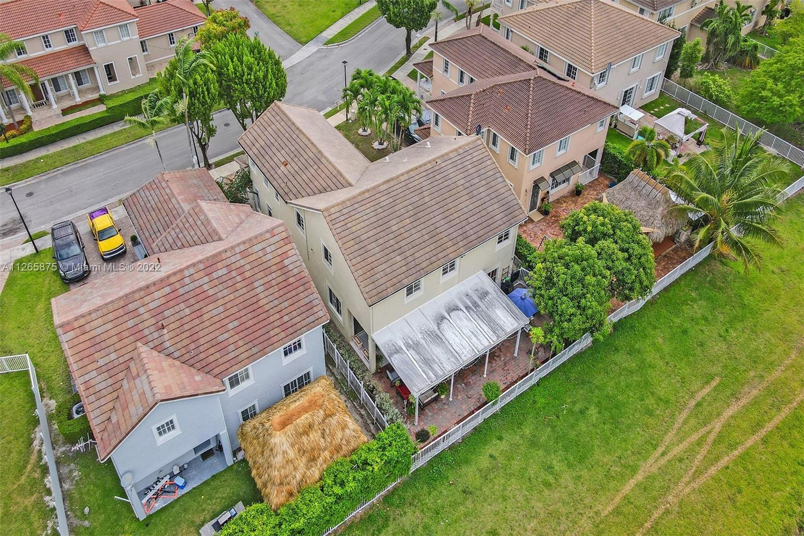 27846 Southwest 142nd Avenue Homestead, FL 33032 - Photo 55 of 56 an aerial view of a house with garden space and street view
