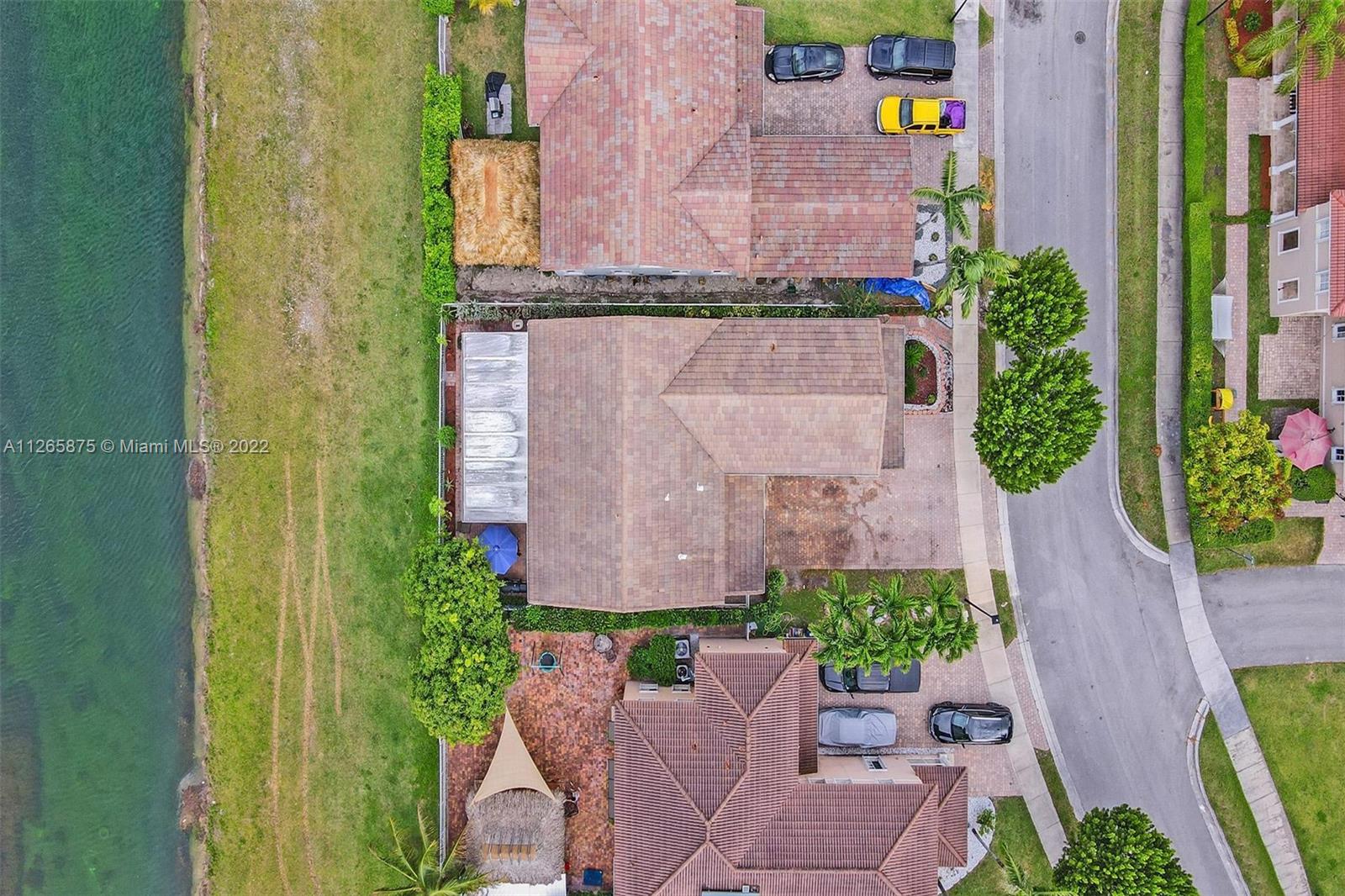 27846 Southwest 142nd Avenue Homestead, FL 33032 - Photo 56 of 56 an aerial view of a house with outdoor space pool seating area and yard